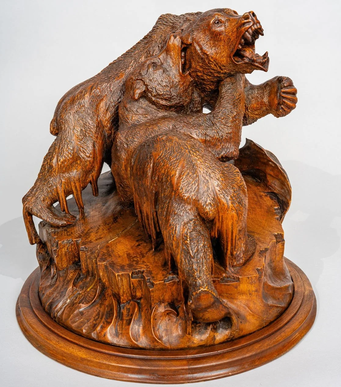 Swiss Black Forest carved walnut bear fighting group on ice floe base, Brienz late 19th century, side view