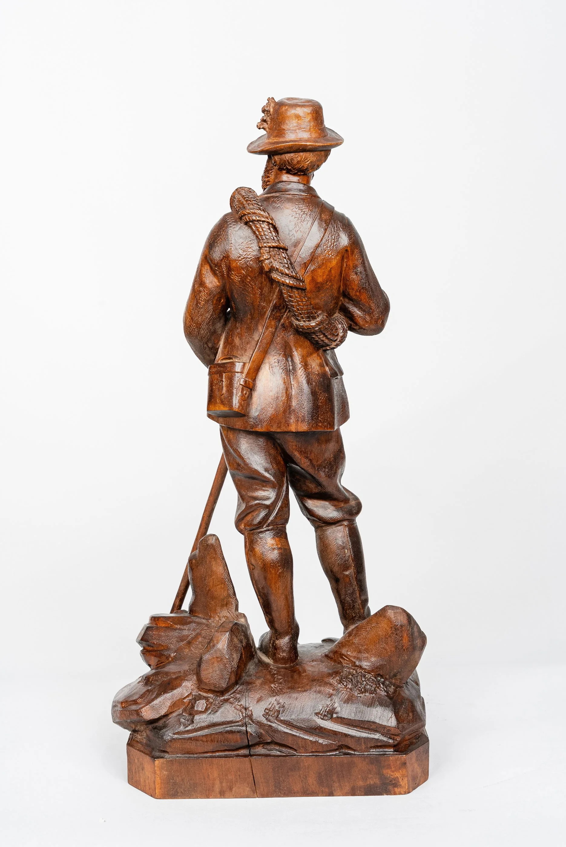 Rear view of Johann Huggler carved walnut alpine hunter, Brienz — Daniels Antiques