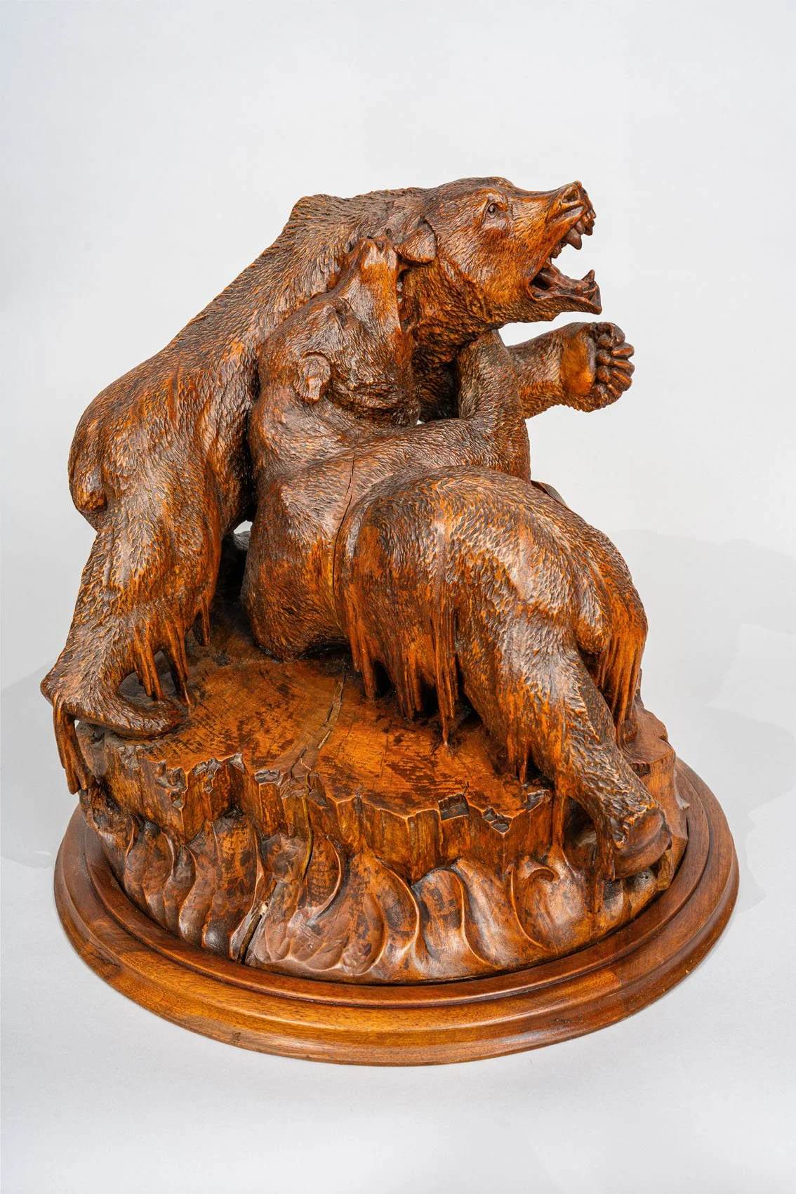 A Black Forest Carved Walnut Scene of Two Bears Fighting, circa 1860.
