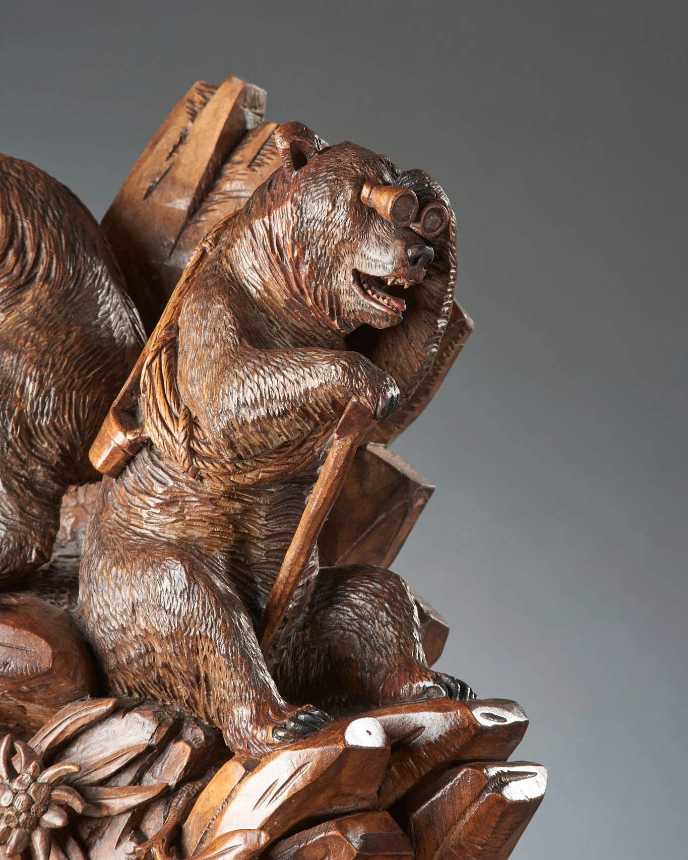 Swiss Black Forest carved walnut mantel clock with mountaineering bears, Brienz, circa 1900, detail. Illustrated in Swiss Carvings: The Art of the Black Forest, 1820–1940, plate 00.
