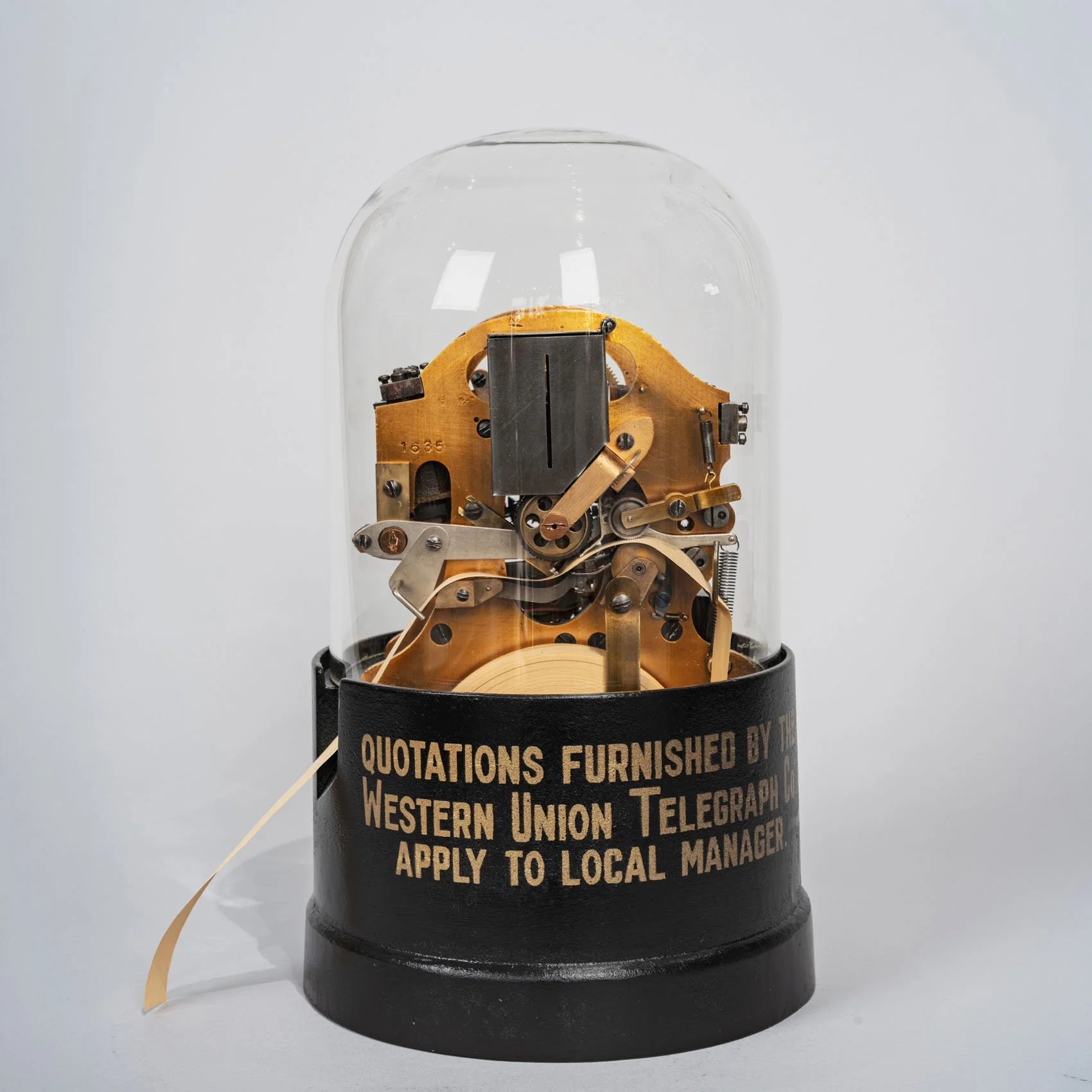 Western Union Telegraph Company Stock Ticker, circa 1915 — Self-Winding, Original Glass Dome & Base