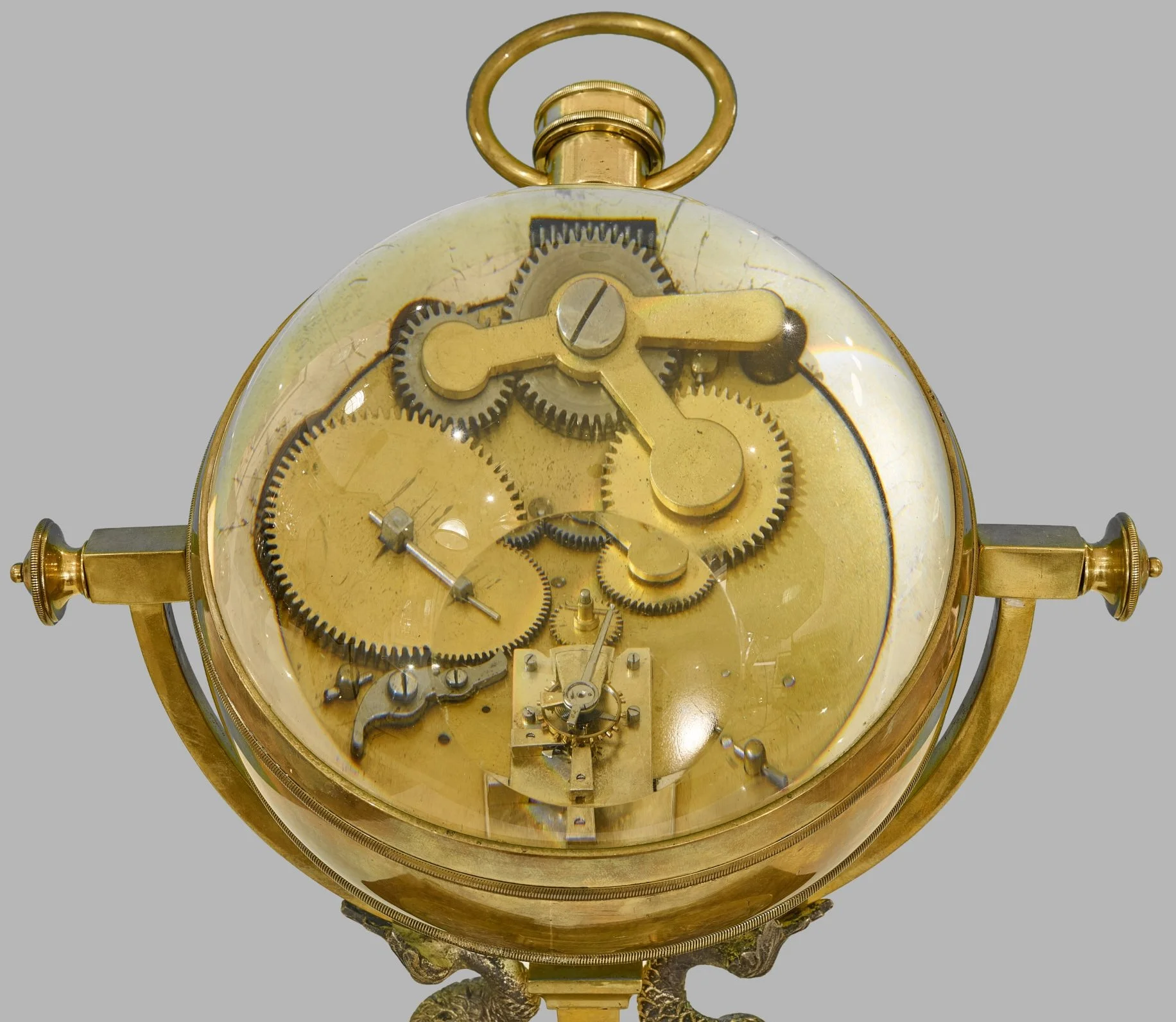 Close view of ball clock movement, gears and escapement — Daniels Antiques
