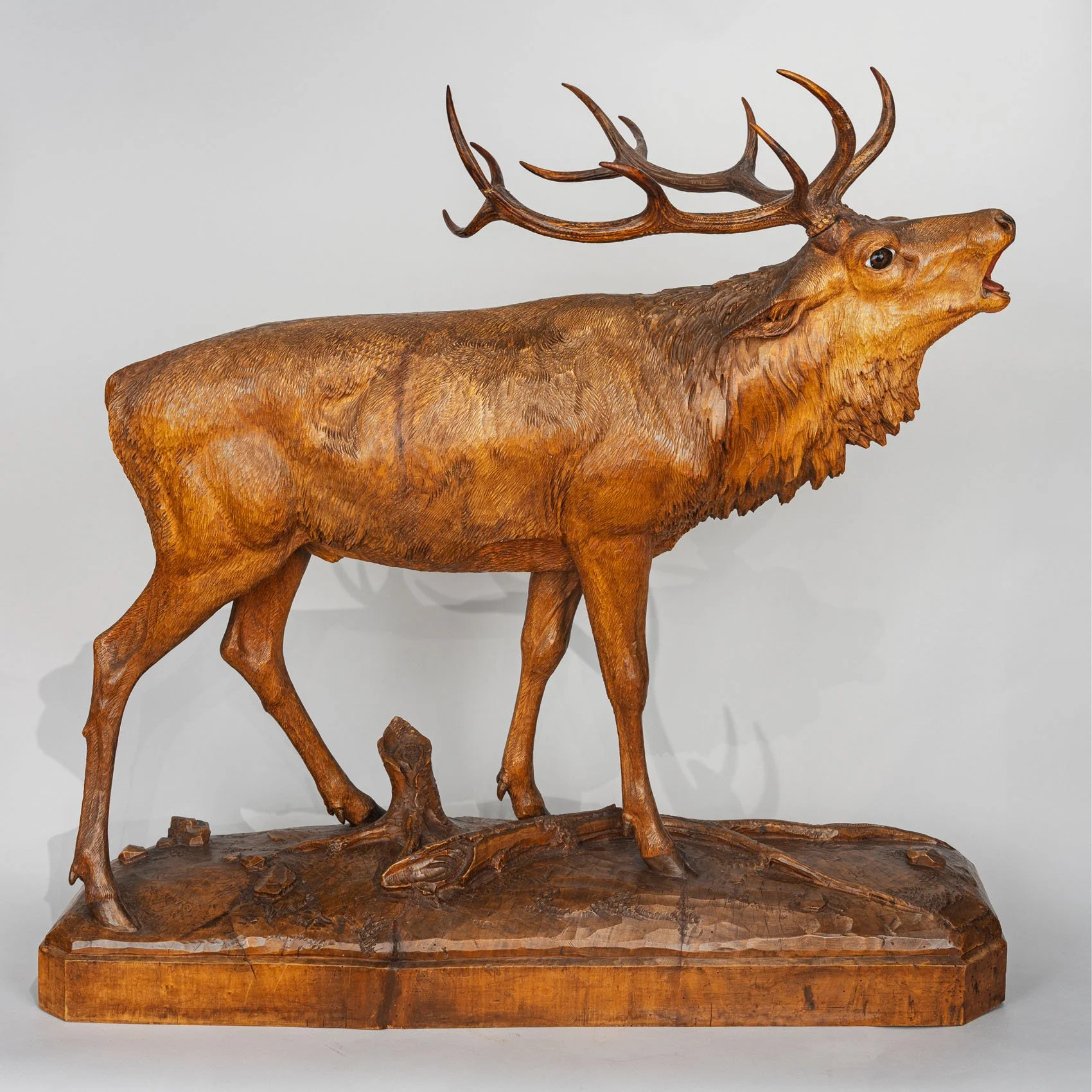 A Monumental Swiss Black Forest Carved Linden Wood Bellowing Stag, c.1890