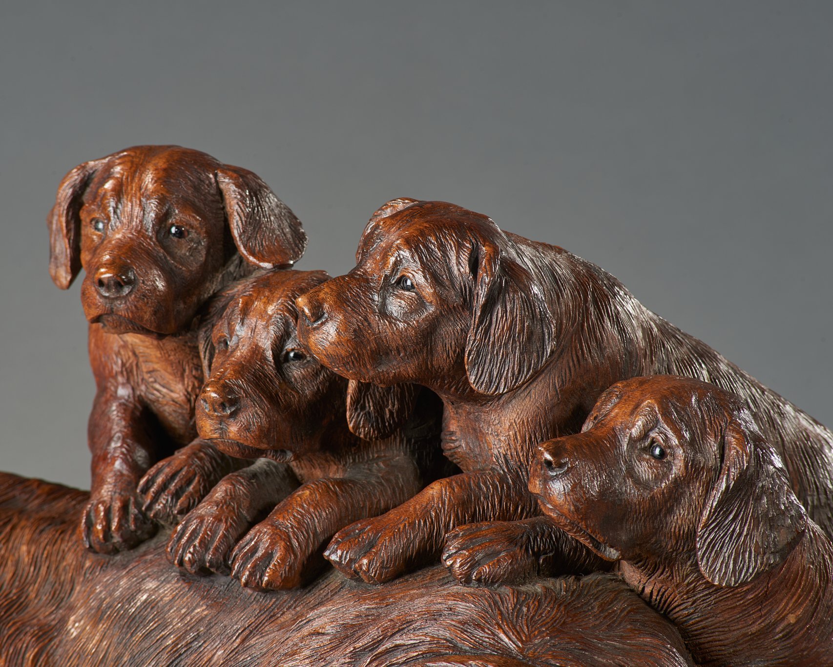 Swiss Black Forest carved walnut group of a dog and four puppies, Brienz, circa 1880, detail. Illustrated in Swiss Carvings: The Art of the Black Forest, 1820–1940, plate 00.
