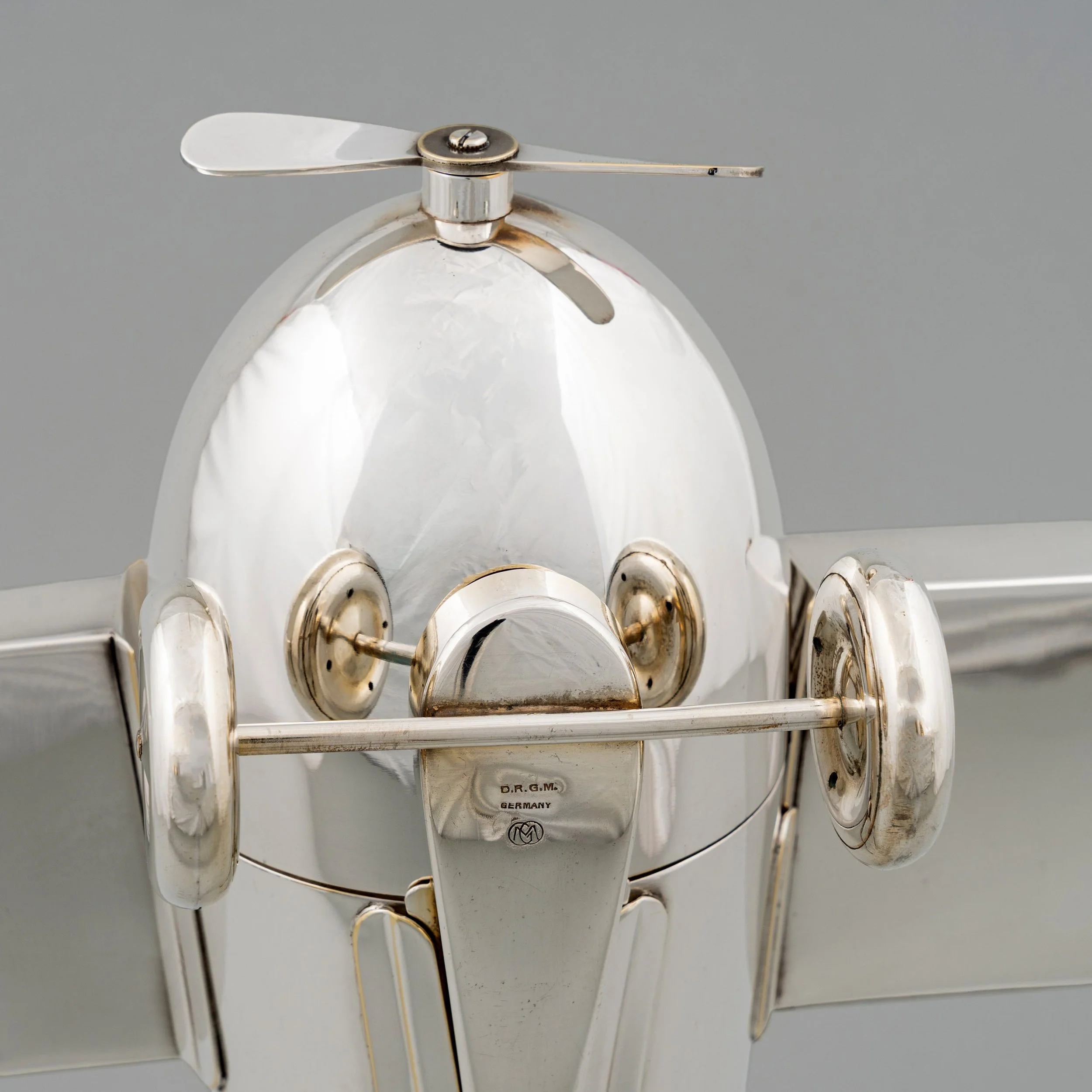 Undercarriage detail showing D.R.G.M. Germany maker's mark, Henckels airplane set — Daniels Antiques