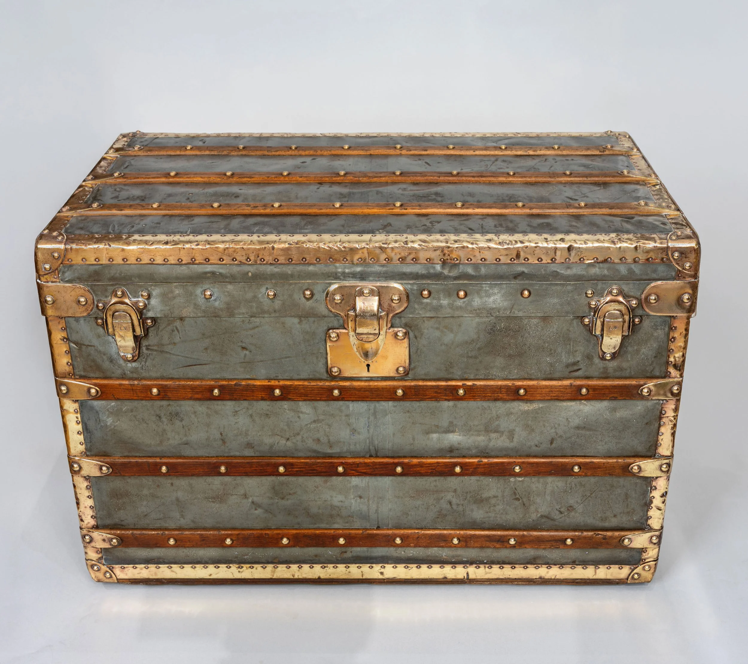 Front of a Louis Vuitton zinc trunk, circa 1895, with brass lock, hasp latches and slats — Daniels Antiques