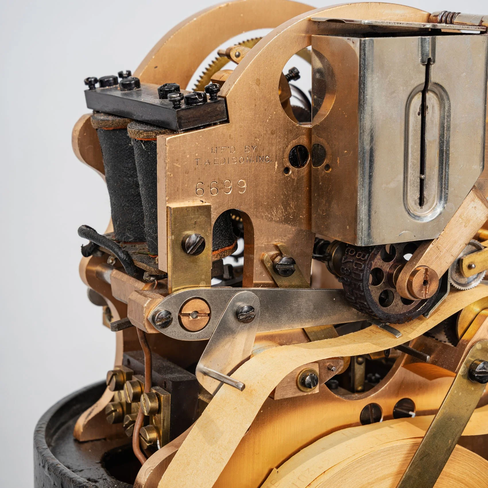 Brass mechanism detail stamped Mfd by T.A. Edison Inc, Western Union stock ticker 1915