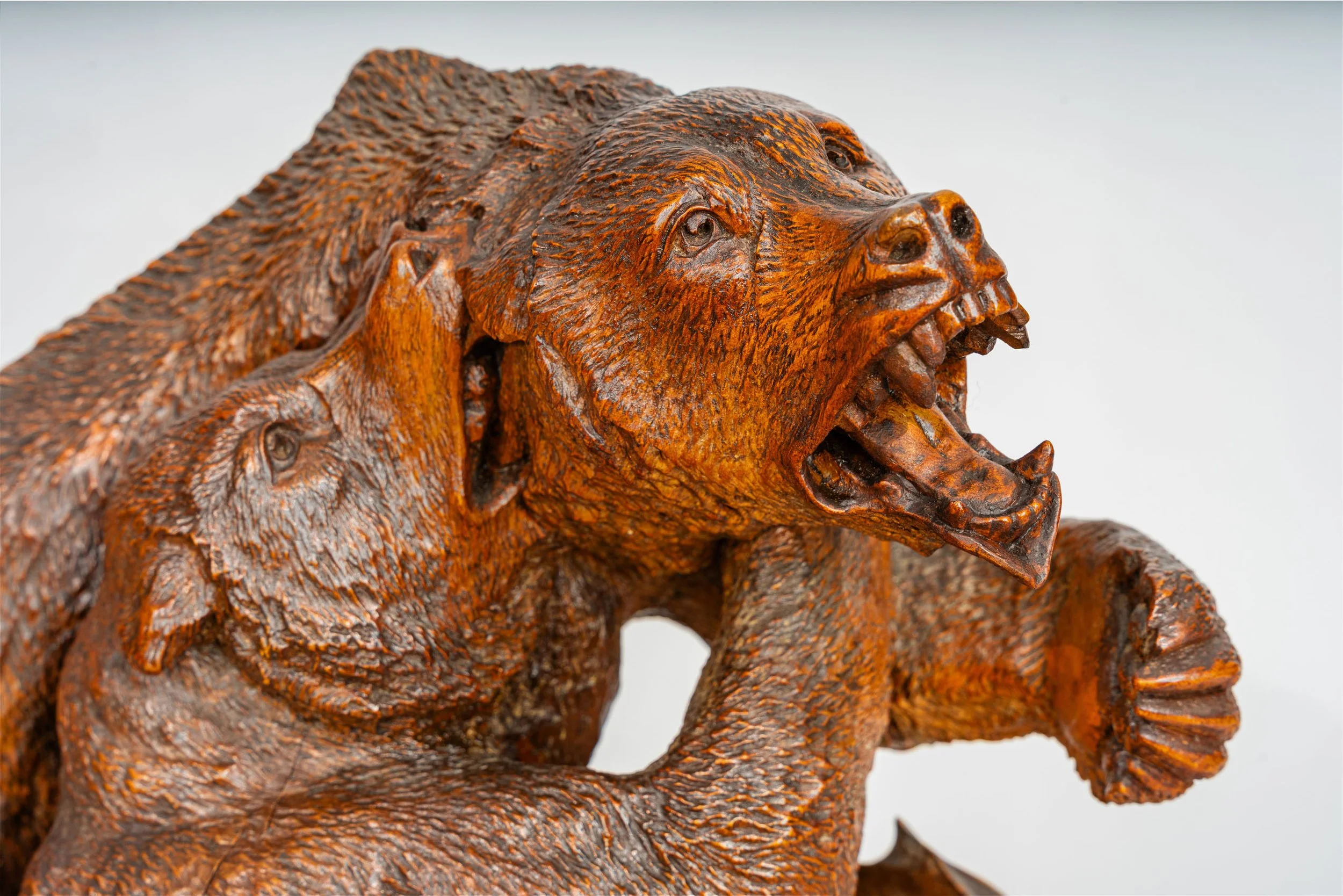 Detail of rearing bear with open jaw, articulated teeth and tongue, Swiss Black Forest carved walnut bear group, Brienz late 19th century
