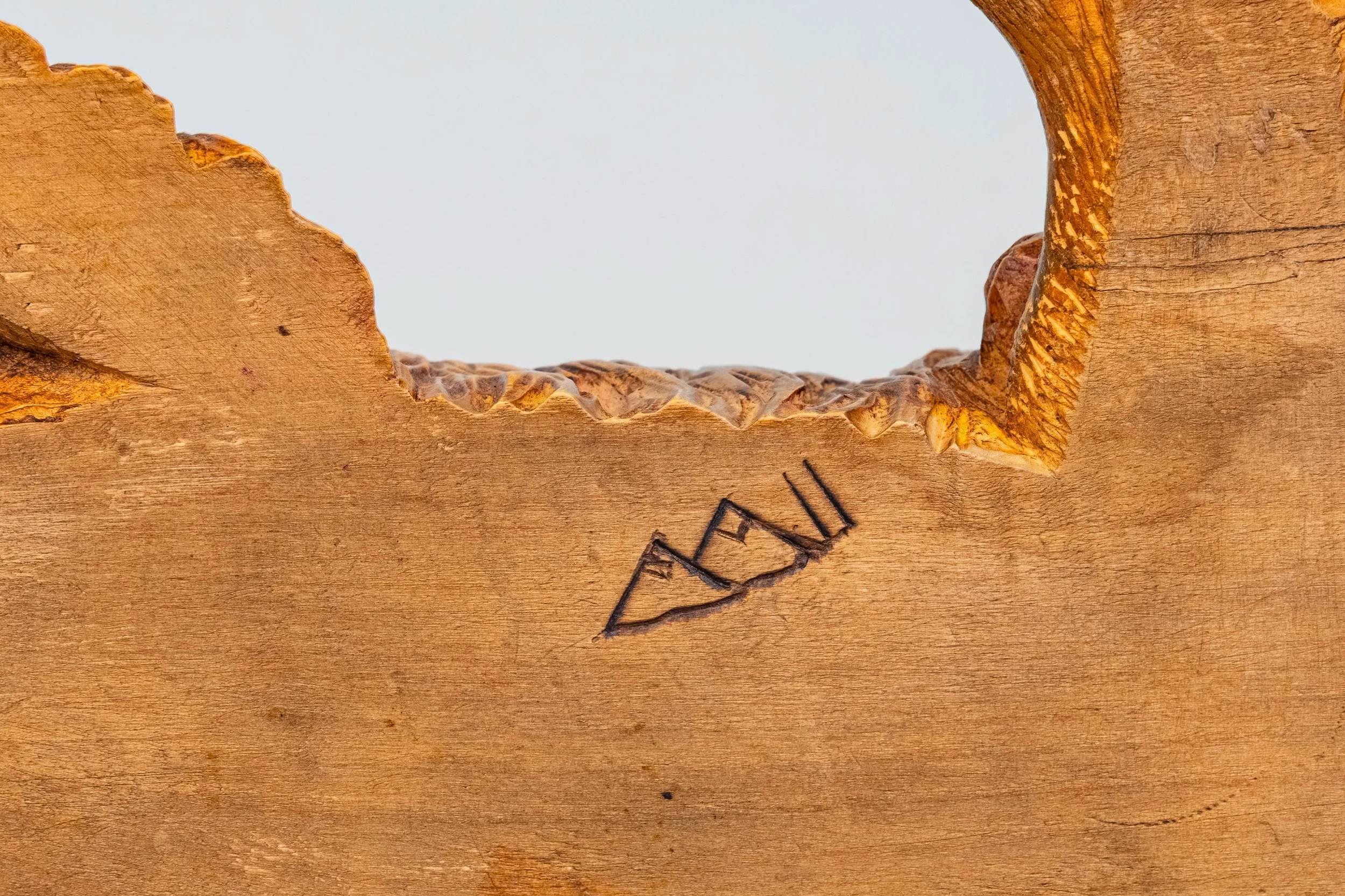 Burn mark on underside of Nase carving, Johann Huggler, Brienz 1873