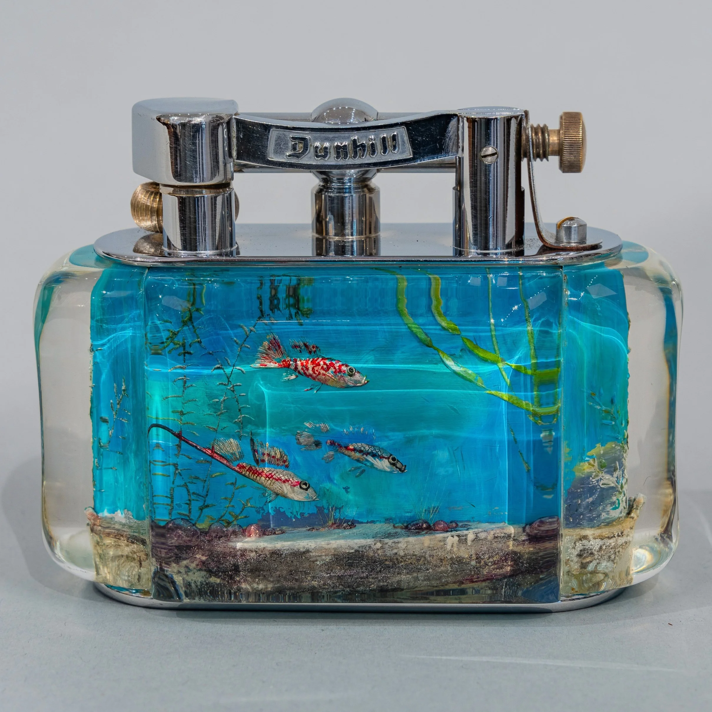 Dunhill Aquarium table lighter, blue lucite, three tropical fish scene, chrome hardware — Daniels Antiques