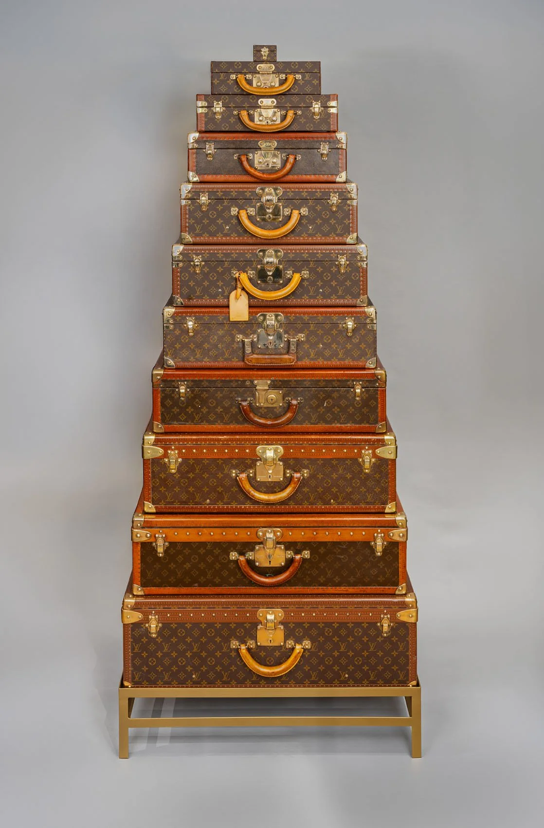 Vintage Louis Vuitton Graduated Stack of Eleven Trunks on Custom Stand