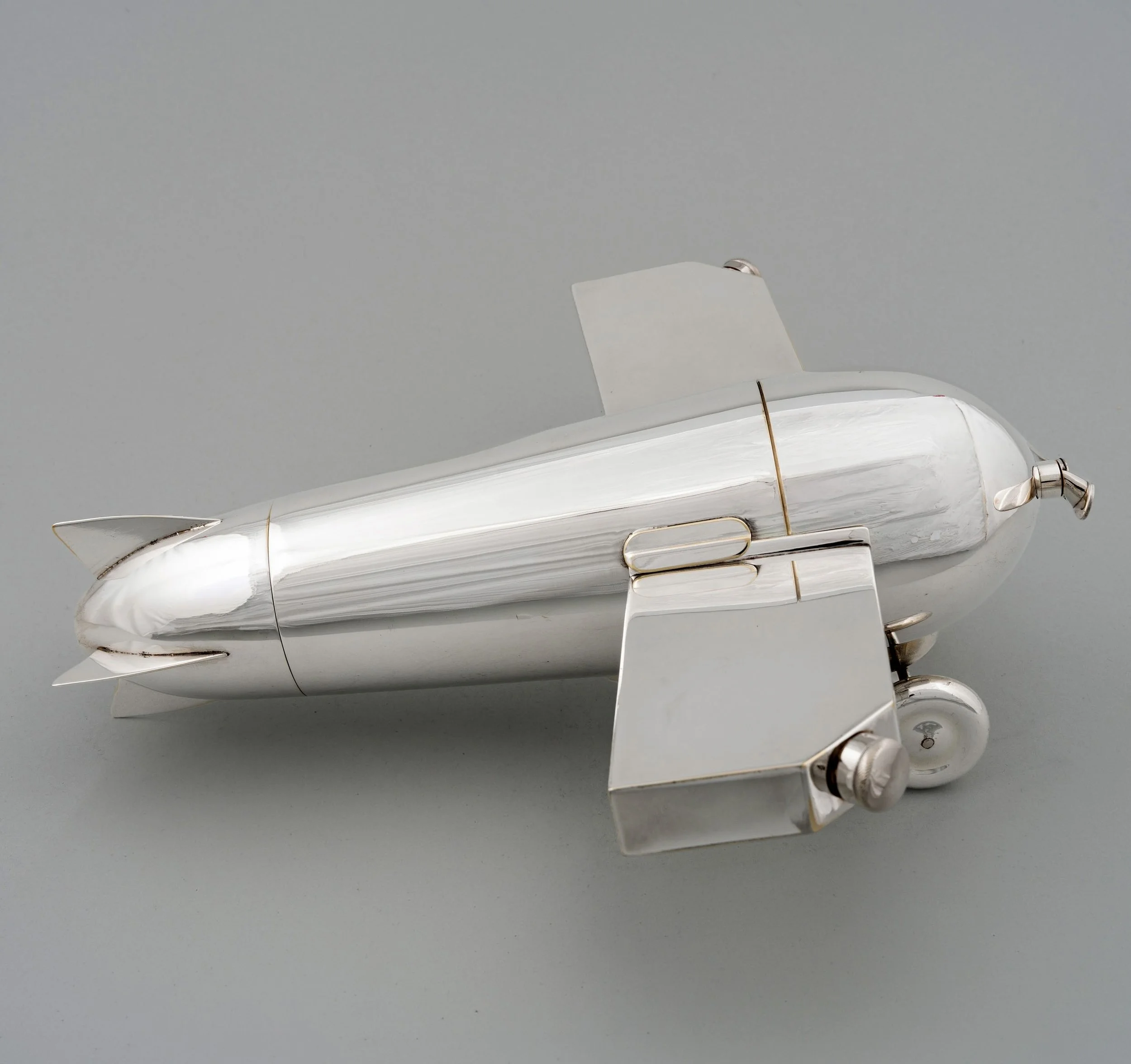 Henckels airplane cocktail set side profile showing fuselage and tail, circa 1928 — Daniels Antiques