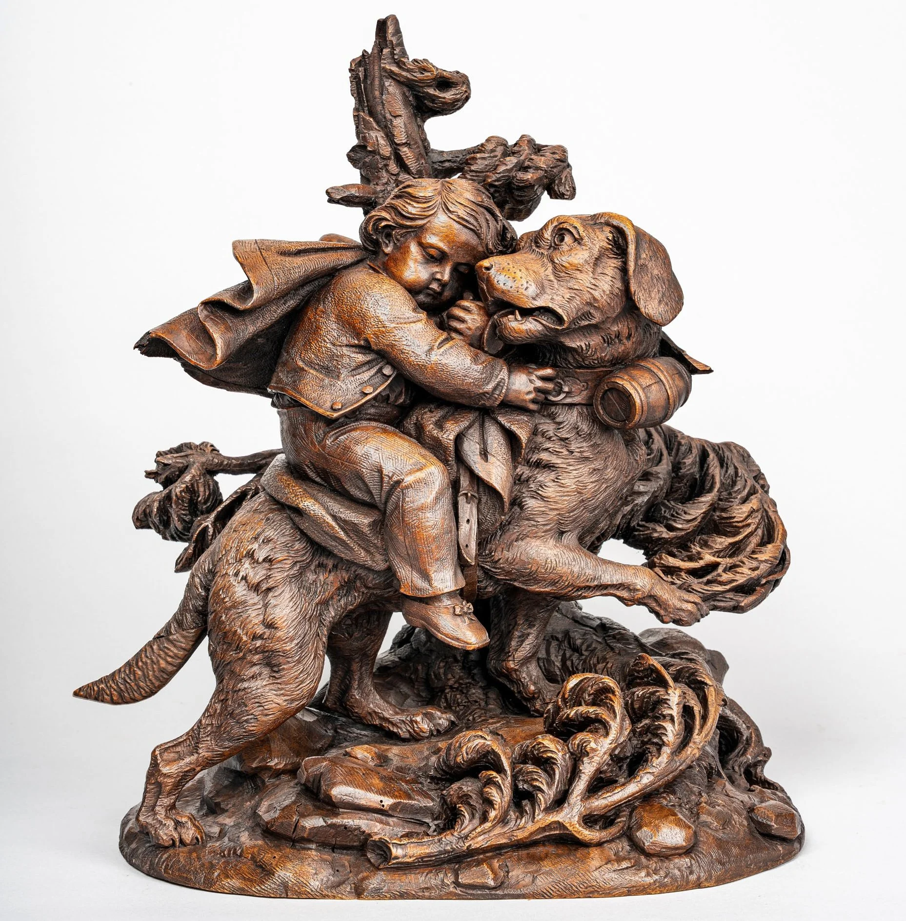 Carved walnut group of a boy embracing a St. Bernard, Brienz, mid-19th century Swiss Black Forest carving — Daniels Antiques
