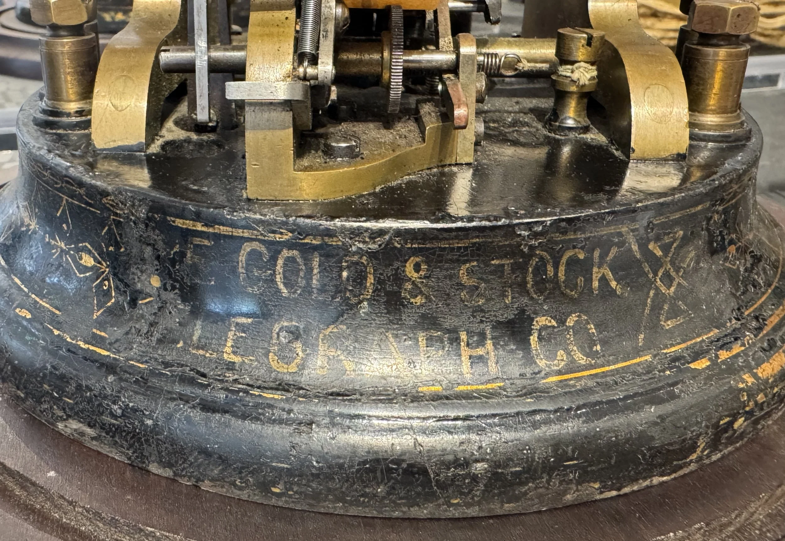Gold and Stock Telegraph Company cast-iron base gold lettering antique stock ticker — Daniels Antiques