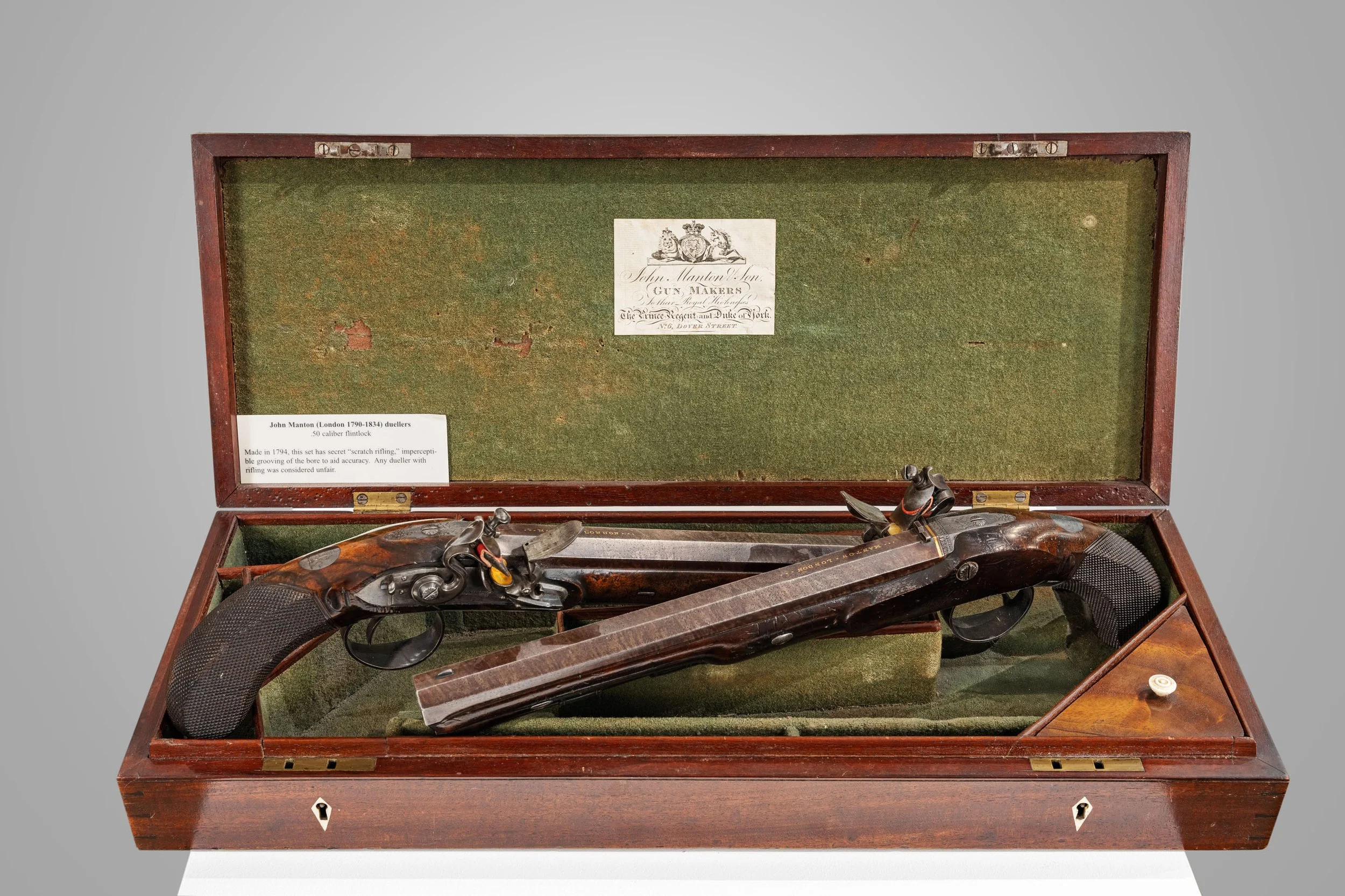 John Manton flintlock duelling pistols, gold-signed barrels, in green baize-lined case — Daniels Antiques