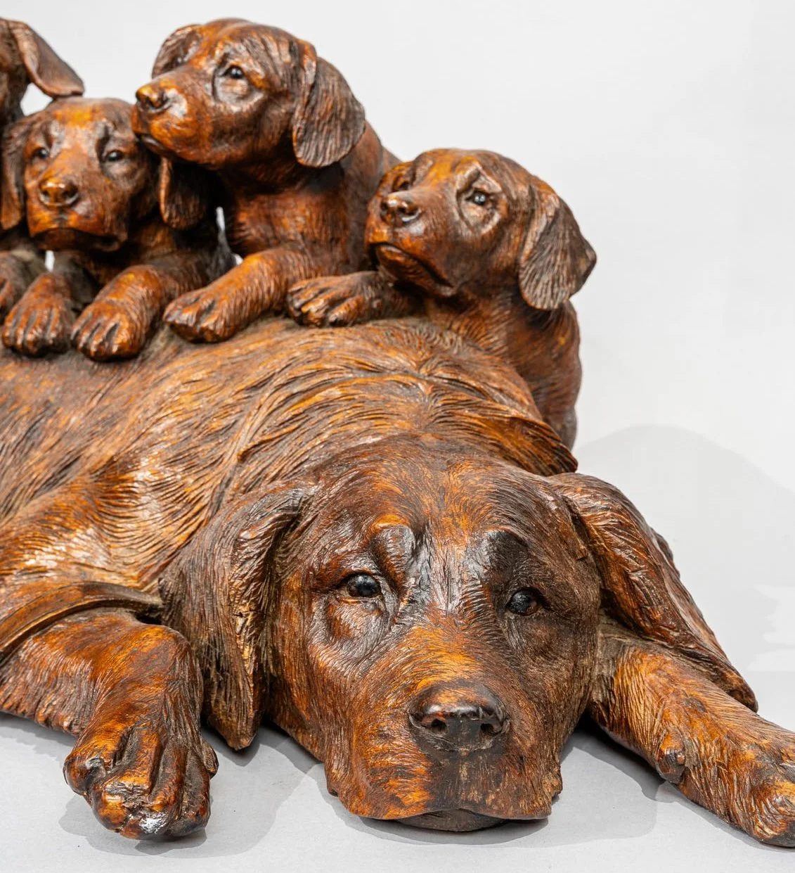 Swiss Black Forest Carved Walnut Group of a Hound and Four Pups, Walter Mader, Brienz, circa 1870