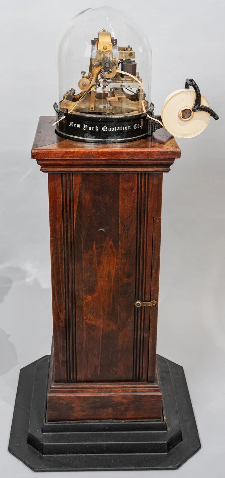 New York Quotation Company antique stock ticker c.1880s cast-iron base period script lettering brass mechanism tape feed — Daniels Antiques