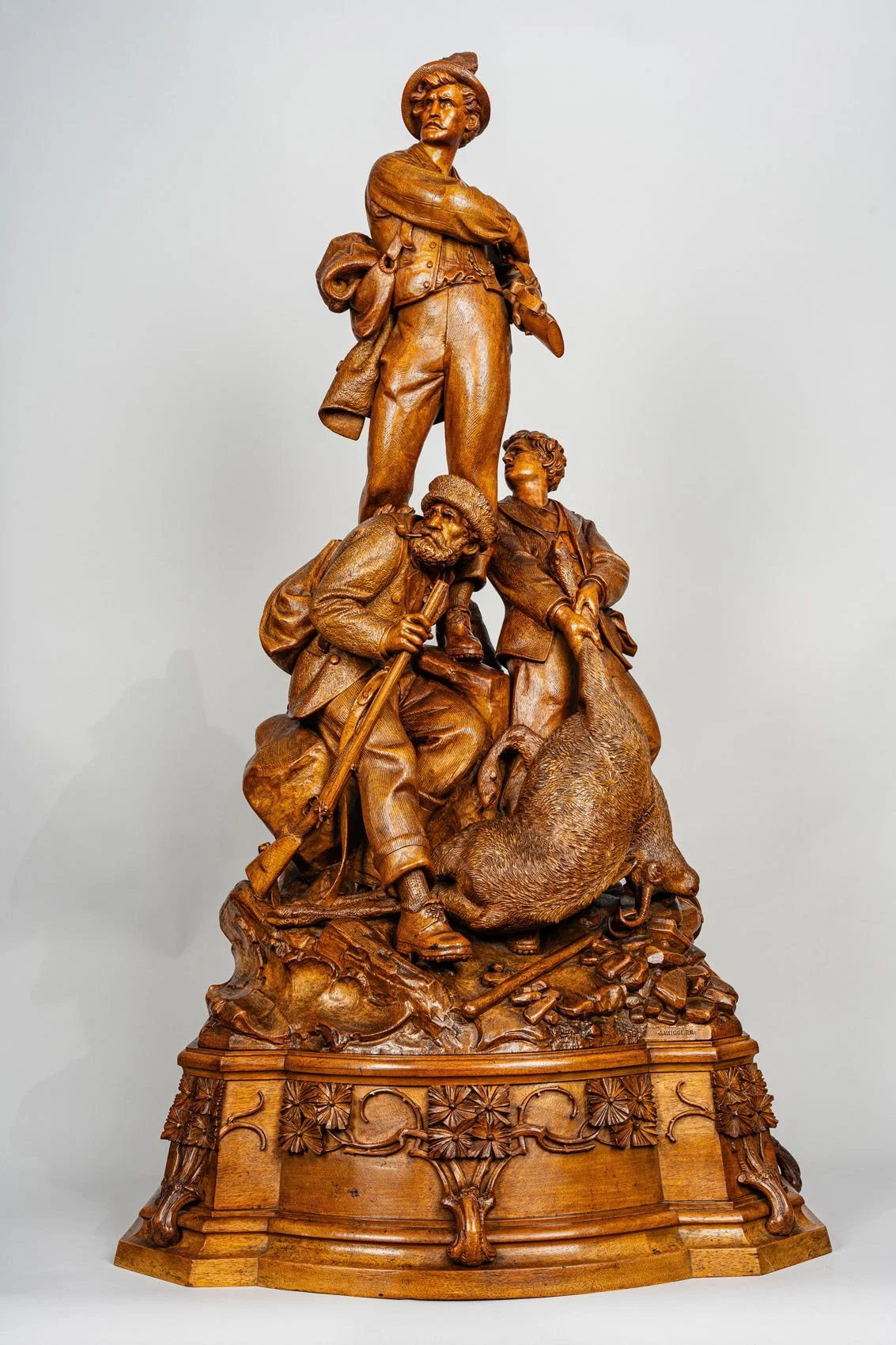 Johann Huggler Three Ages of Man, monumental carved walnut hunter group, Brienz circa 1870, full view