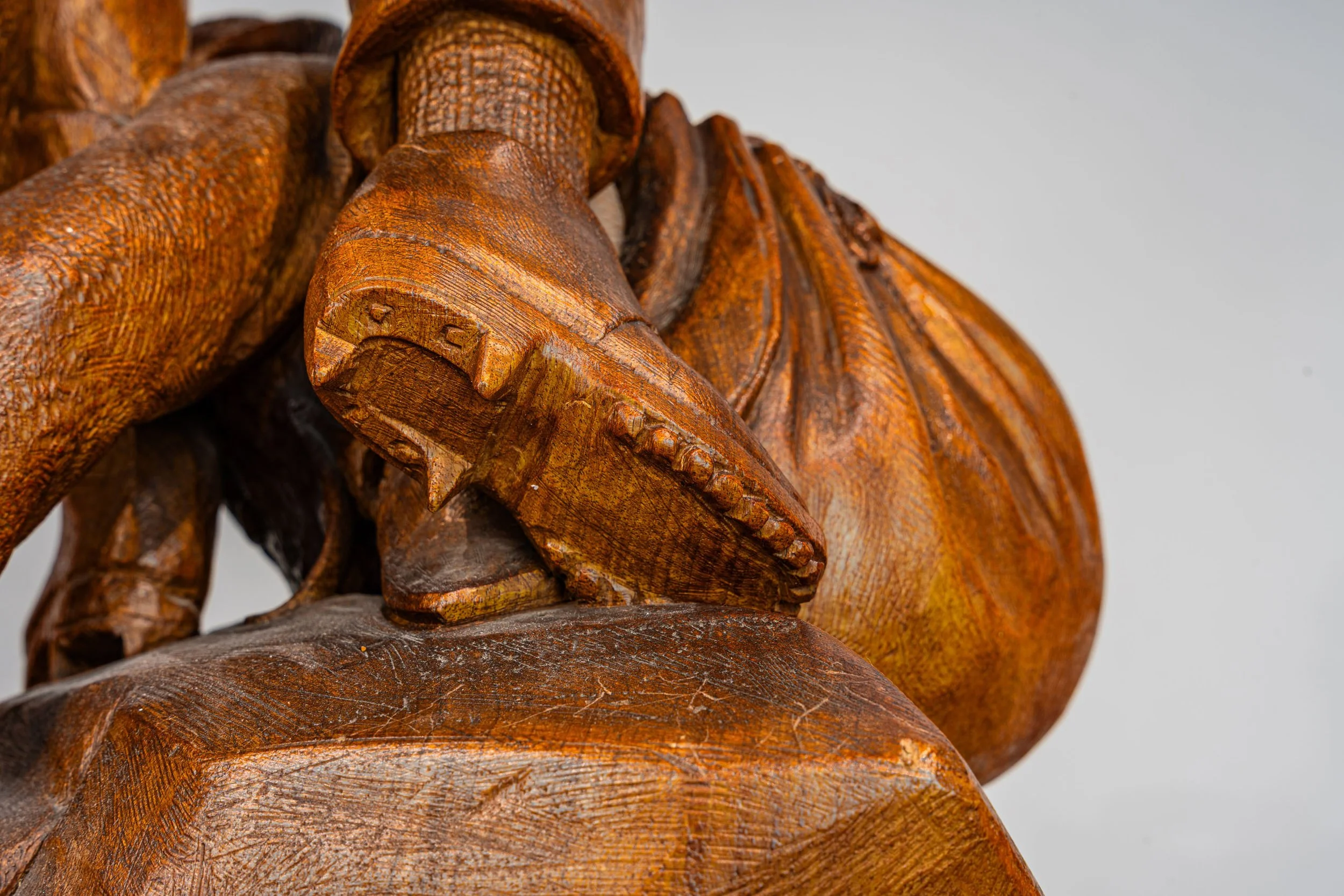 Carved boot detail at base, Johann Huggler hunter group, Brienz circa 1870