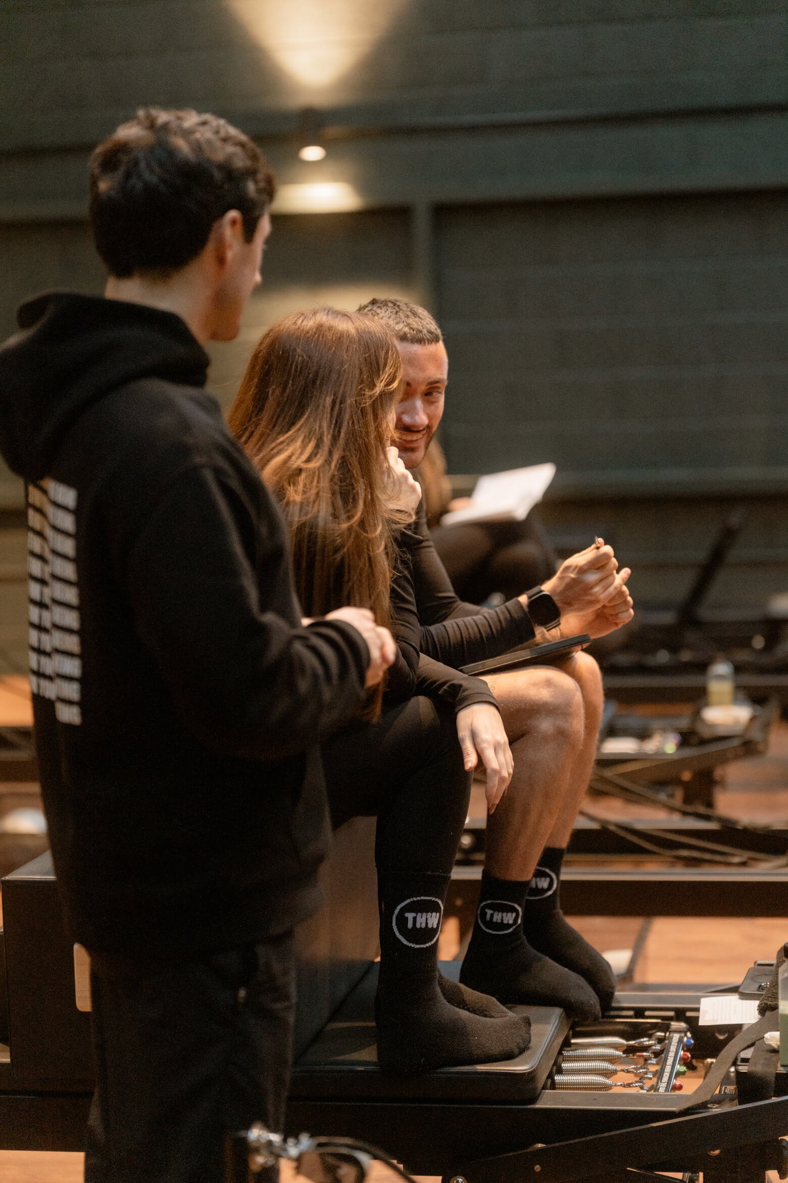 The Holistic Warehouse Reformer Pilates Instructors chatting