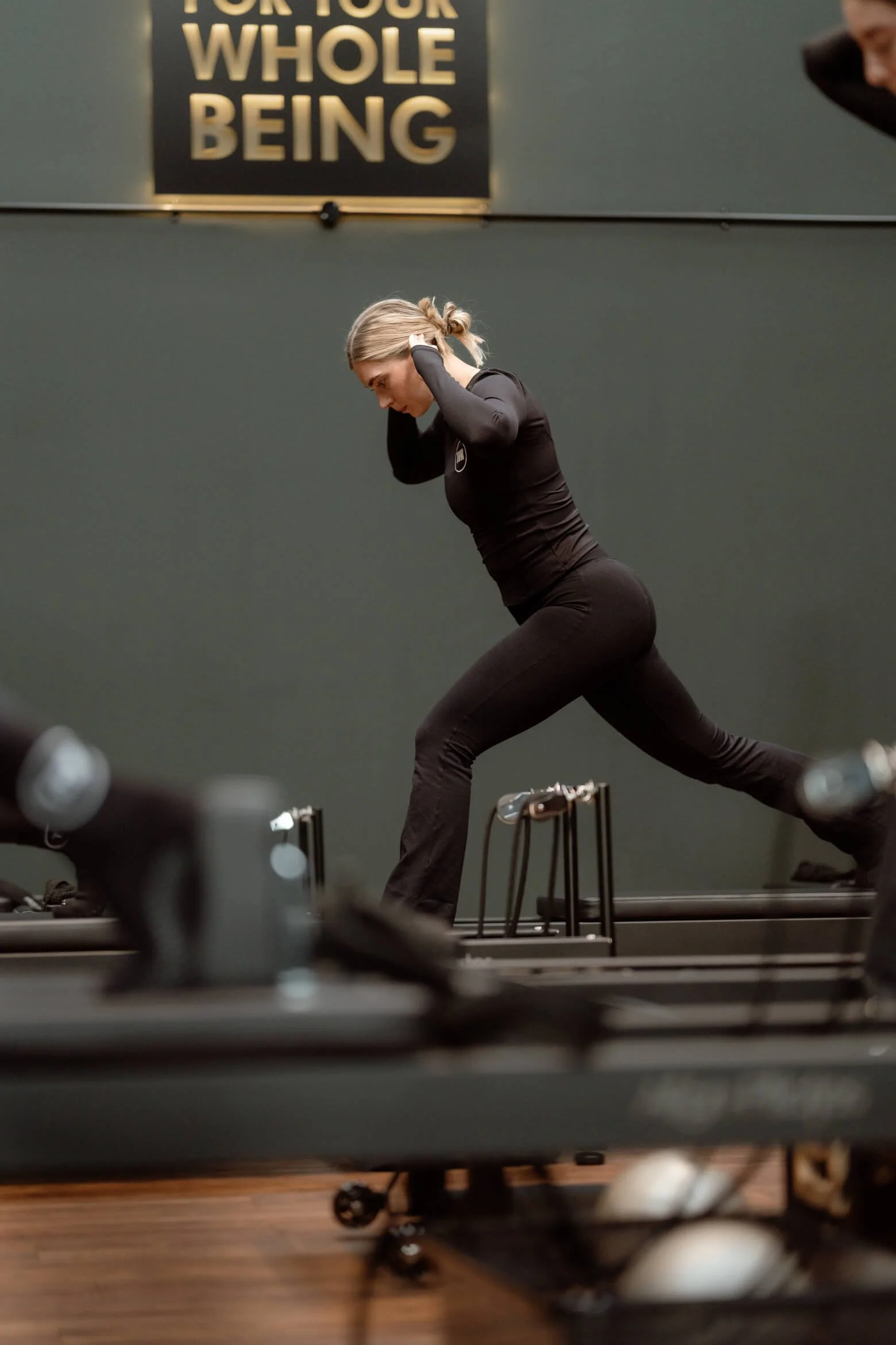 Women practising Reformer Pilates