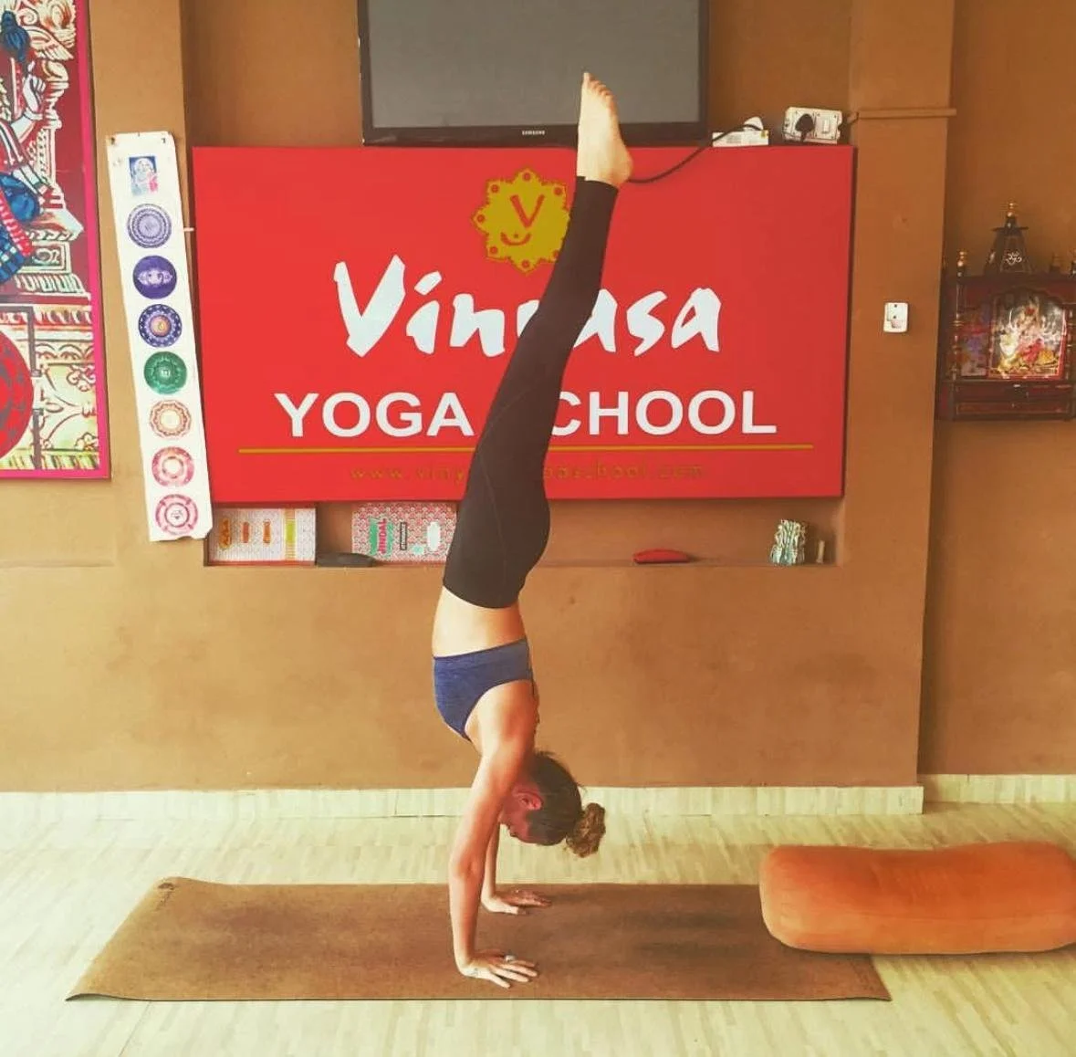 Courtney practising yoga in India