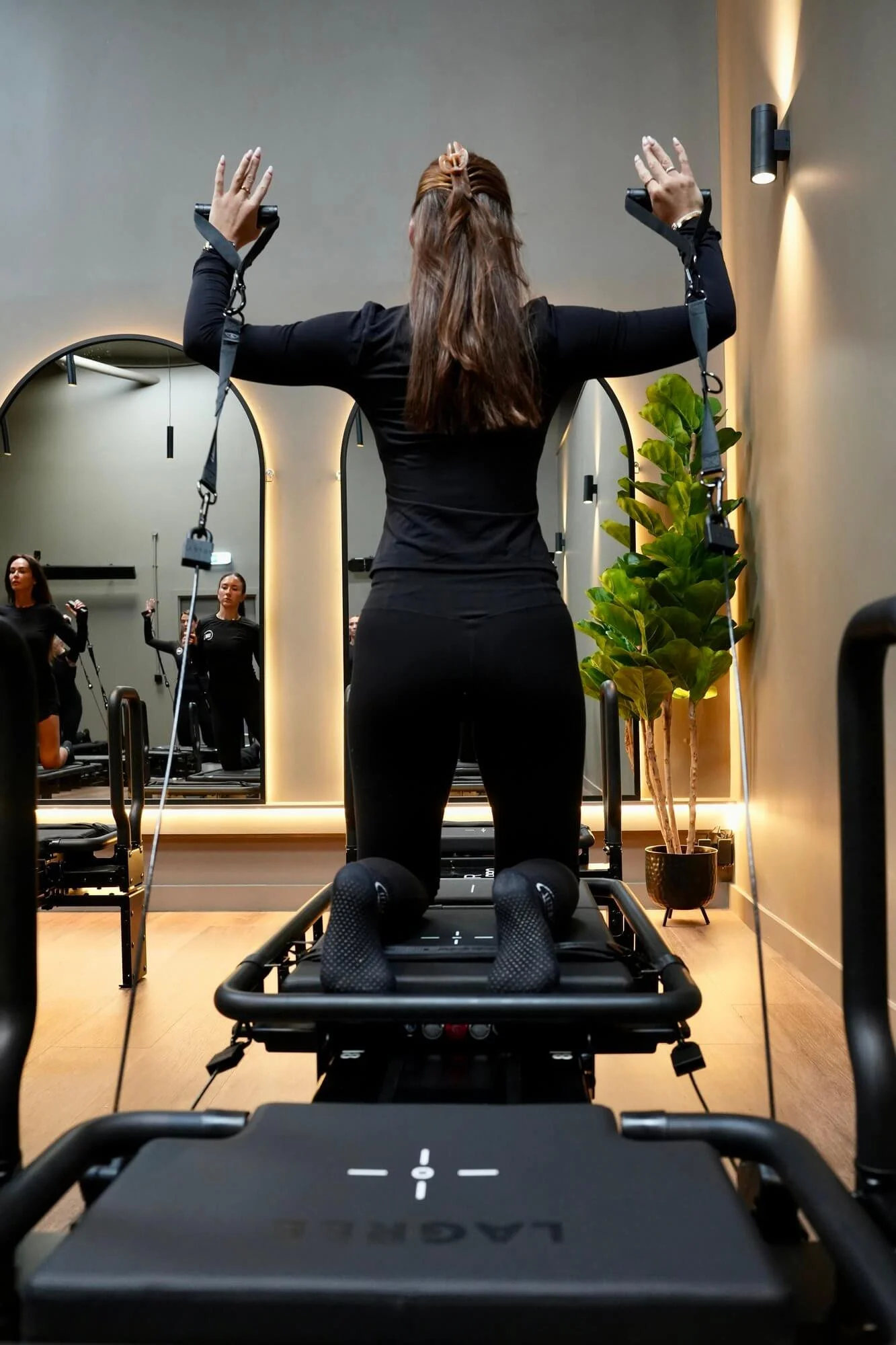 Lagree arm resistance exercise on a mini-pro in THW Glasgow