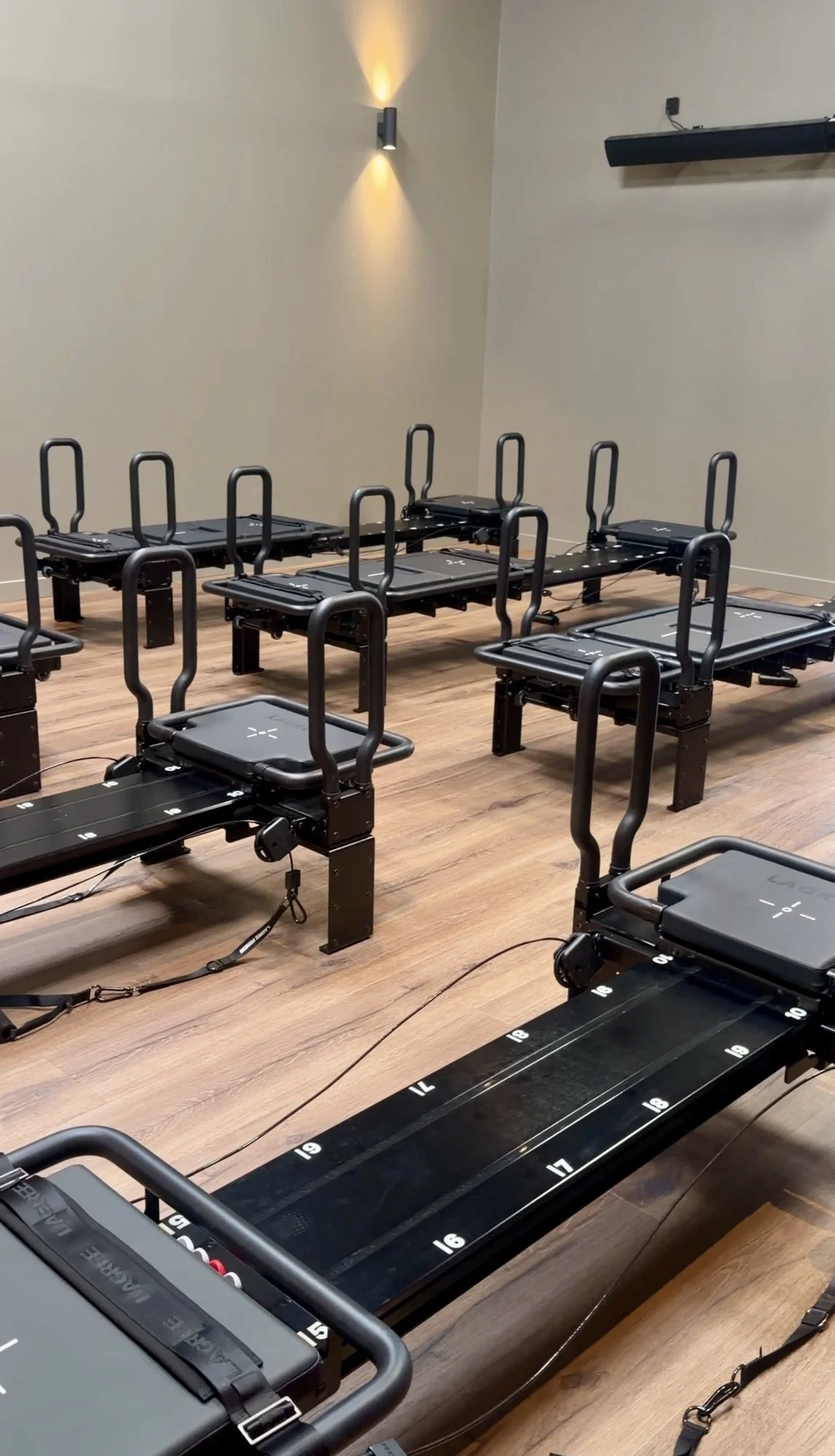 Rows of Lagree MiniPro machines in The Holistic Warehouse, Glasgow's Lagree studio