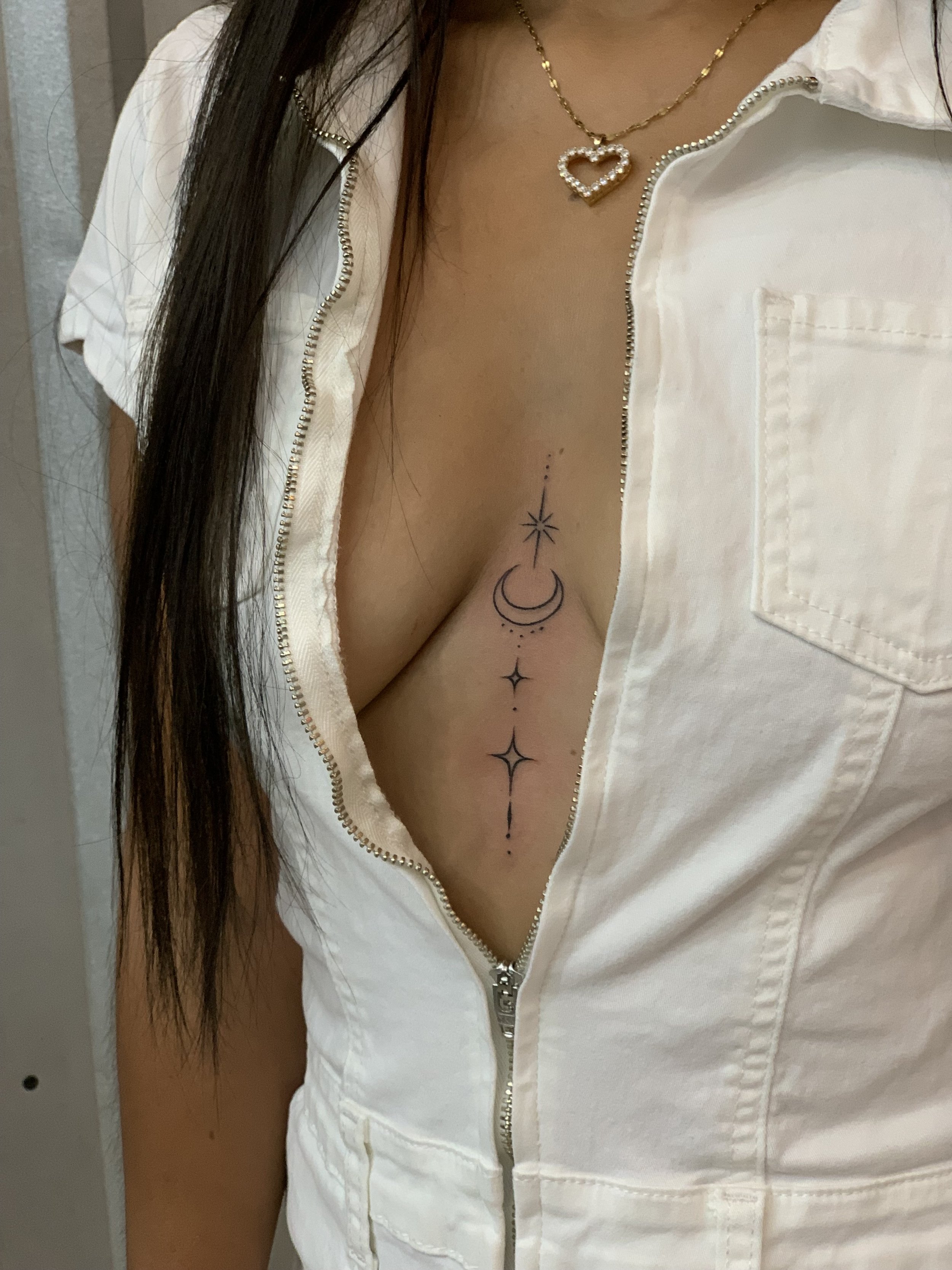 Fine line moon sparkle center boob chest woman by kidd cabo san lucas