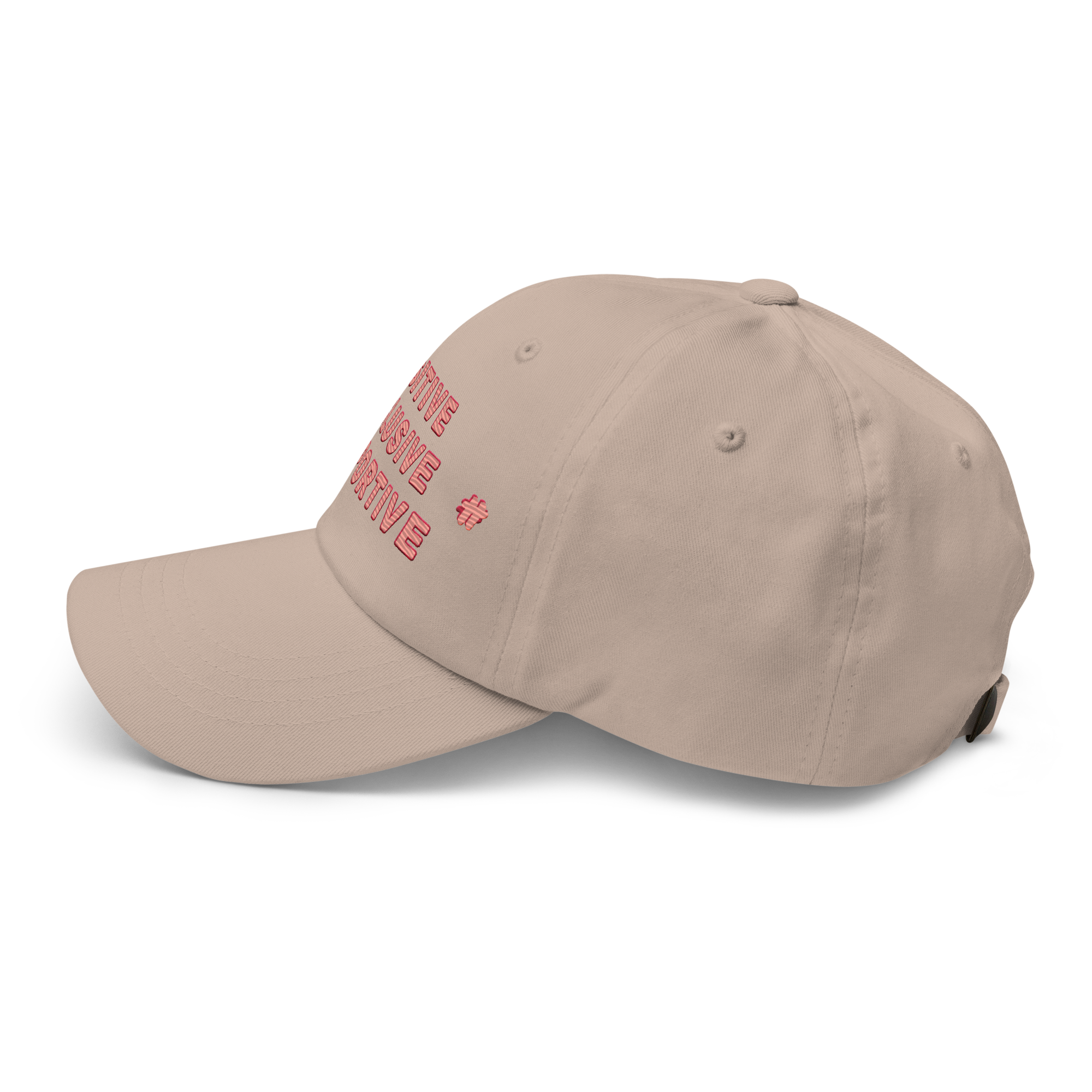 Side view of the stone coloured dad hat with some of the text and one of the #TT logo of the two visible.