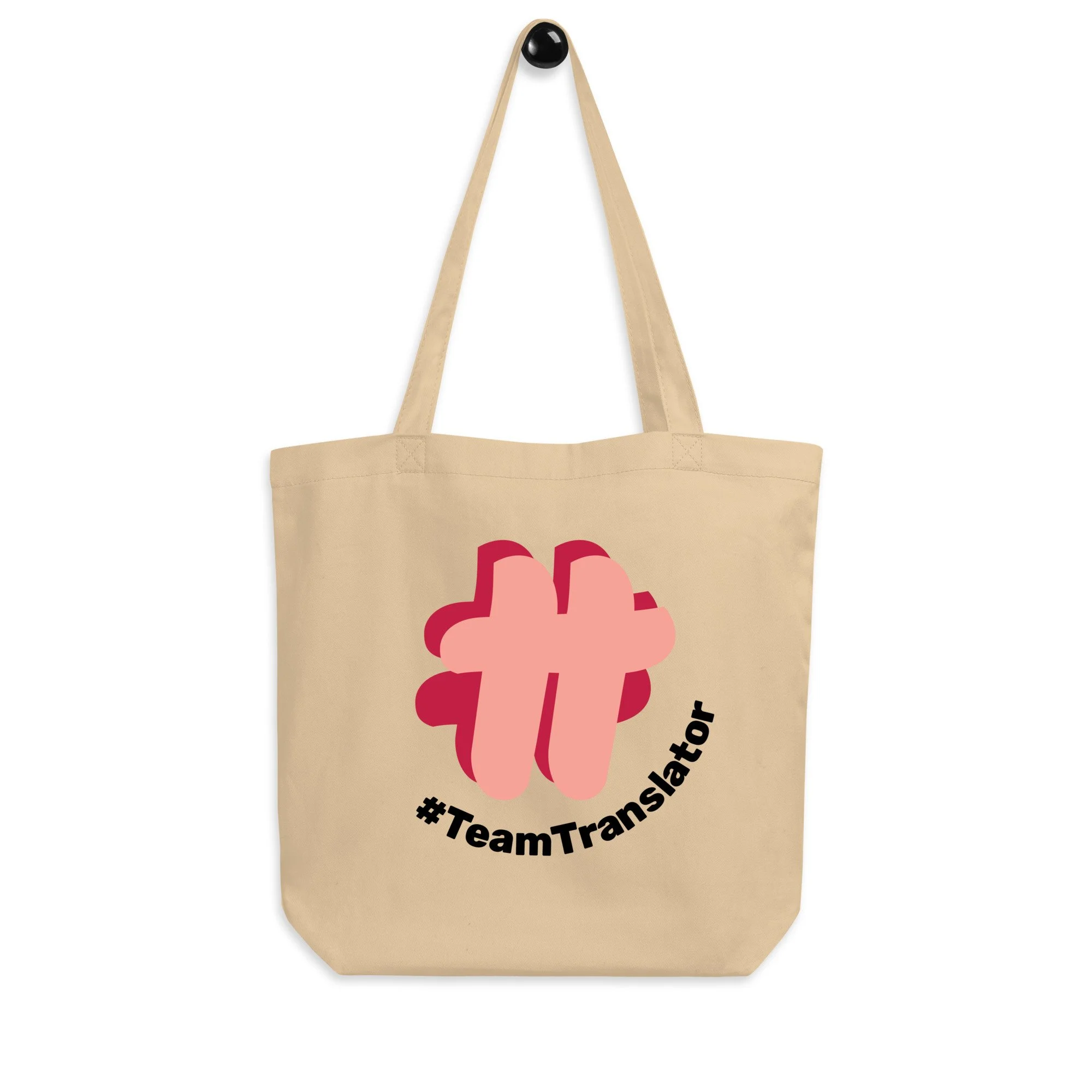 The oyster-coloured (dark creamy coloured) tote bag with a large printed #TT logo.