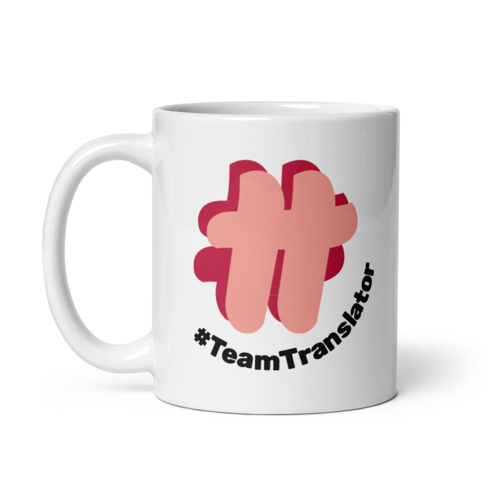 One side of a white mug showing the #TeamTranslator logo.