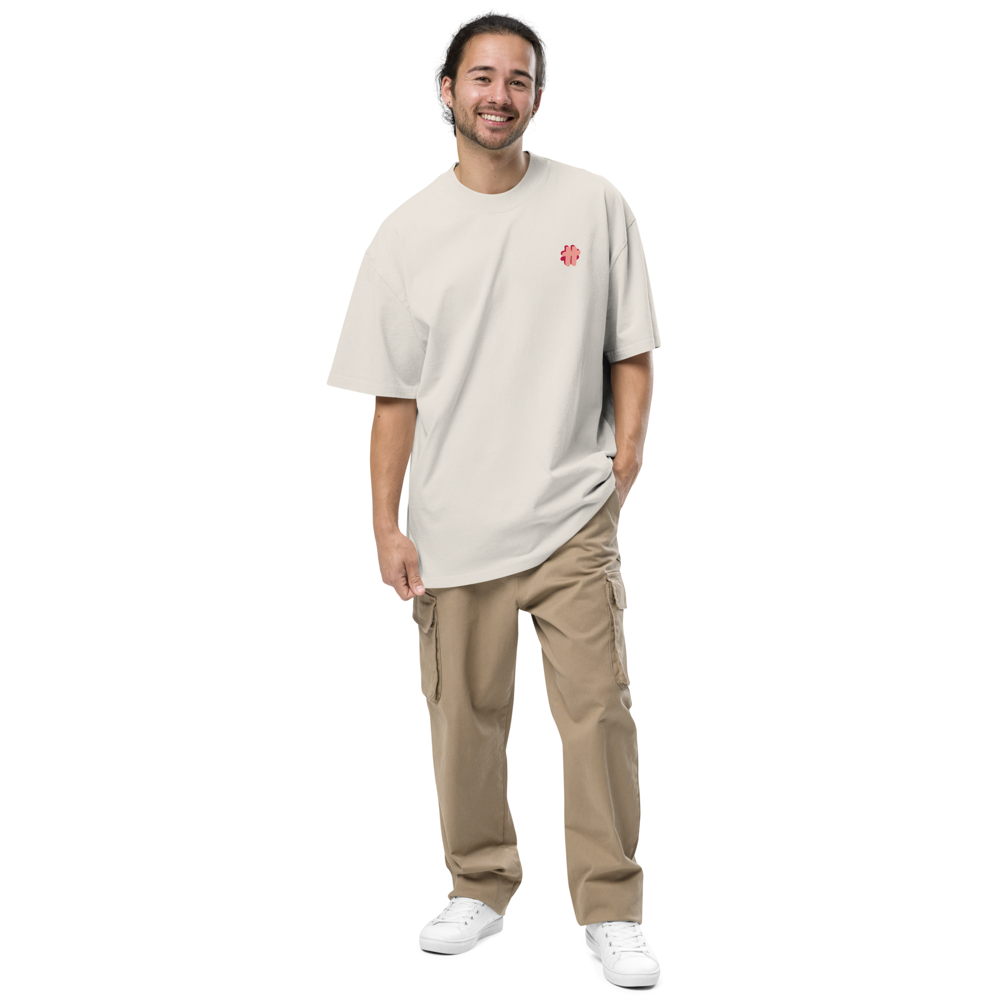 Person in sunglasses wearing an oversized t-shirt in cream colour that has a small #TeamTranslator logo on the left side of the chest.