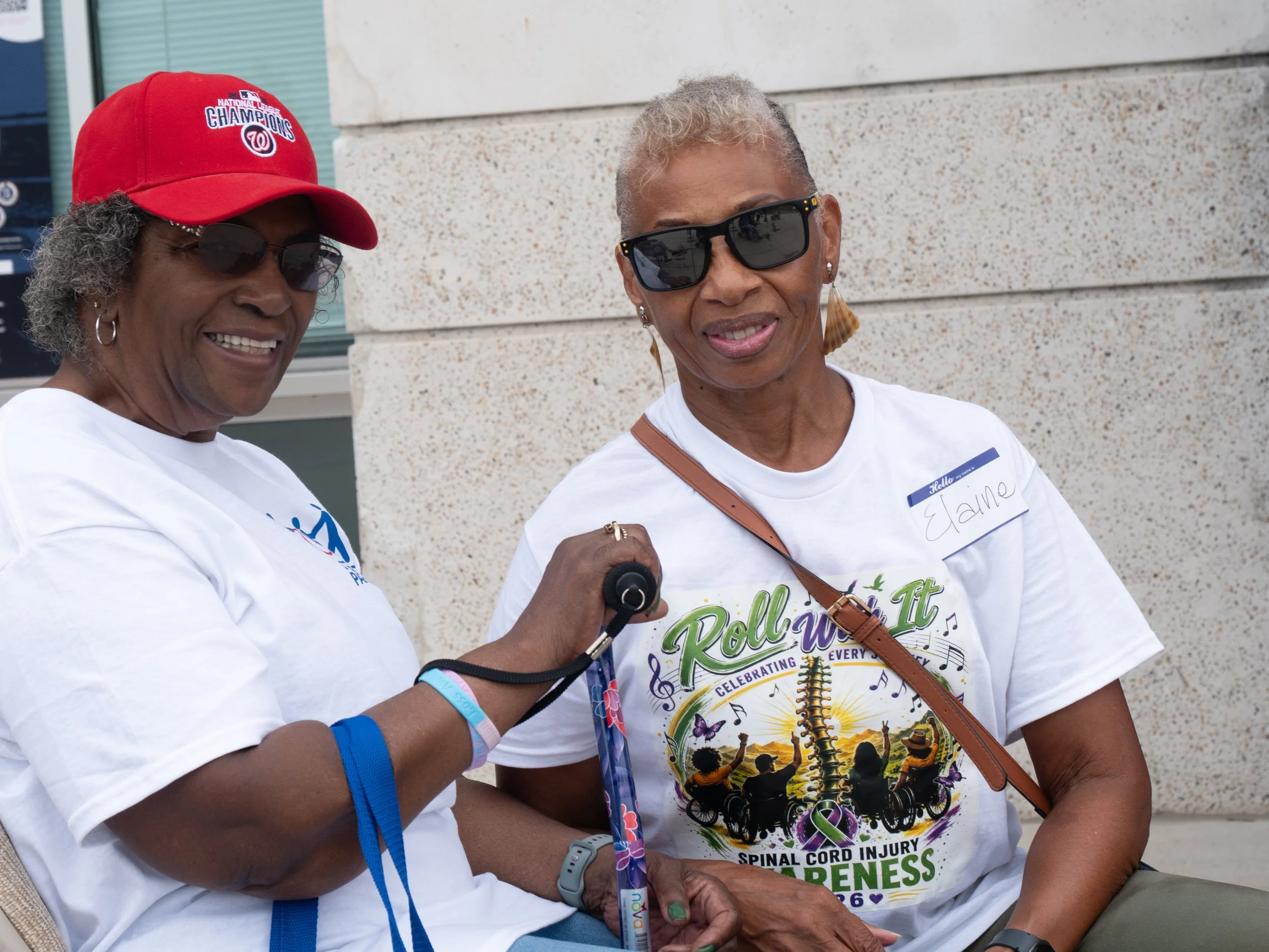 Two attendees smile together during the Play Without Limits event
