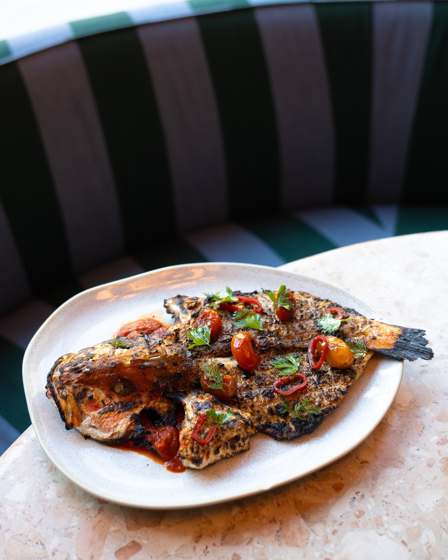 The Whole Grilled Snapper at Dear Daphni topped with chermoula, fresh fresno peppers, and tomatoes&hellip; a dish that you need to try for dinner.⁠
⁠
Love,⁠
⁠
D.D. 🛵⁠
⁠
#snapper #dinner #nightout #phillyrestaurant