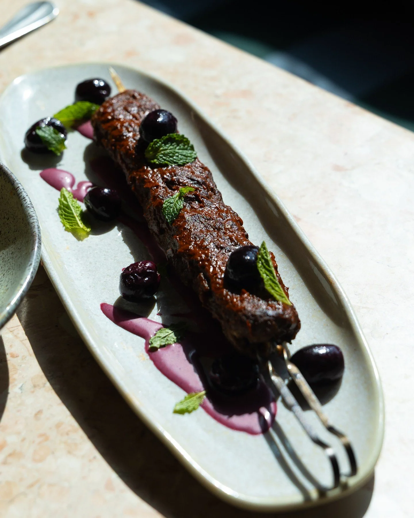 Come for the kebab, stay for the harissa. House merguez with lamb &amp; blistered grapes.⁠
⁠
Love,⁠
D.D. 🛵