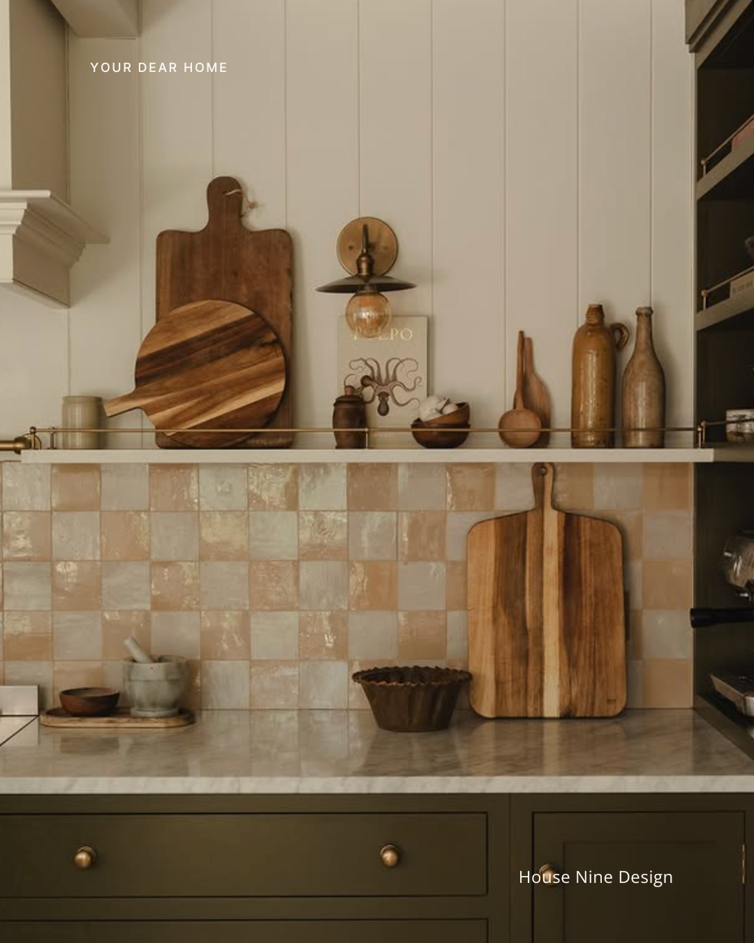 Kitchen countertop styling idea using fresh produce, wooden trays, and neutral decor for a clean designer look