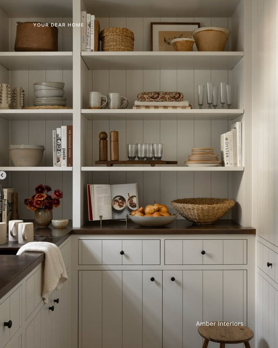 Kitchen countertop styling idea using fresh produce, wooden trays, and neutral decor for a clean designer look