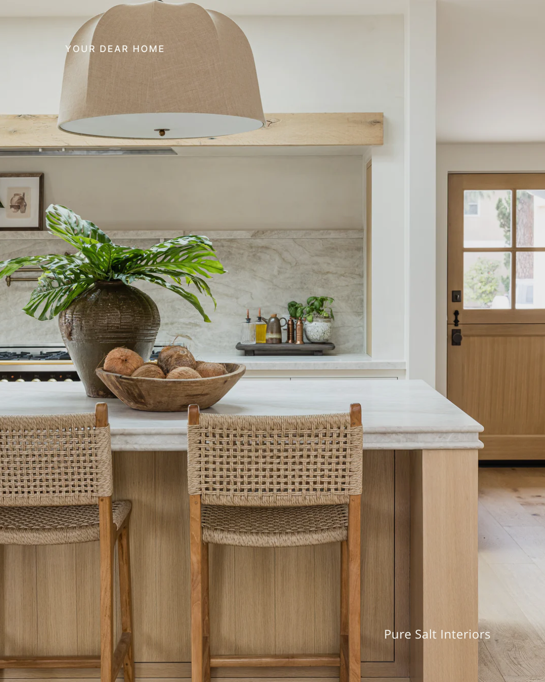 Kitchen countertop styling idea using fresh produce, wooden trays, and neutral decor for a clean designer look