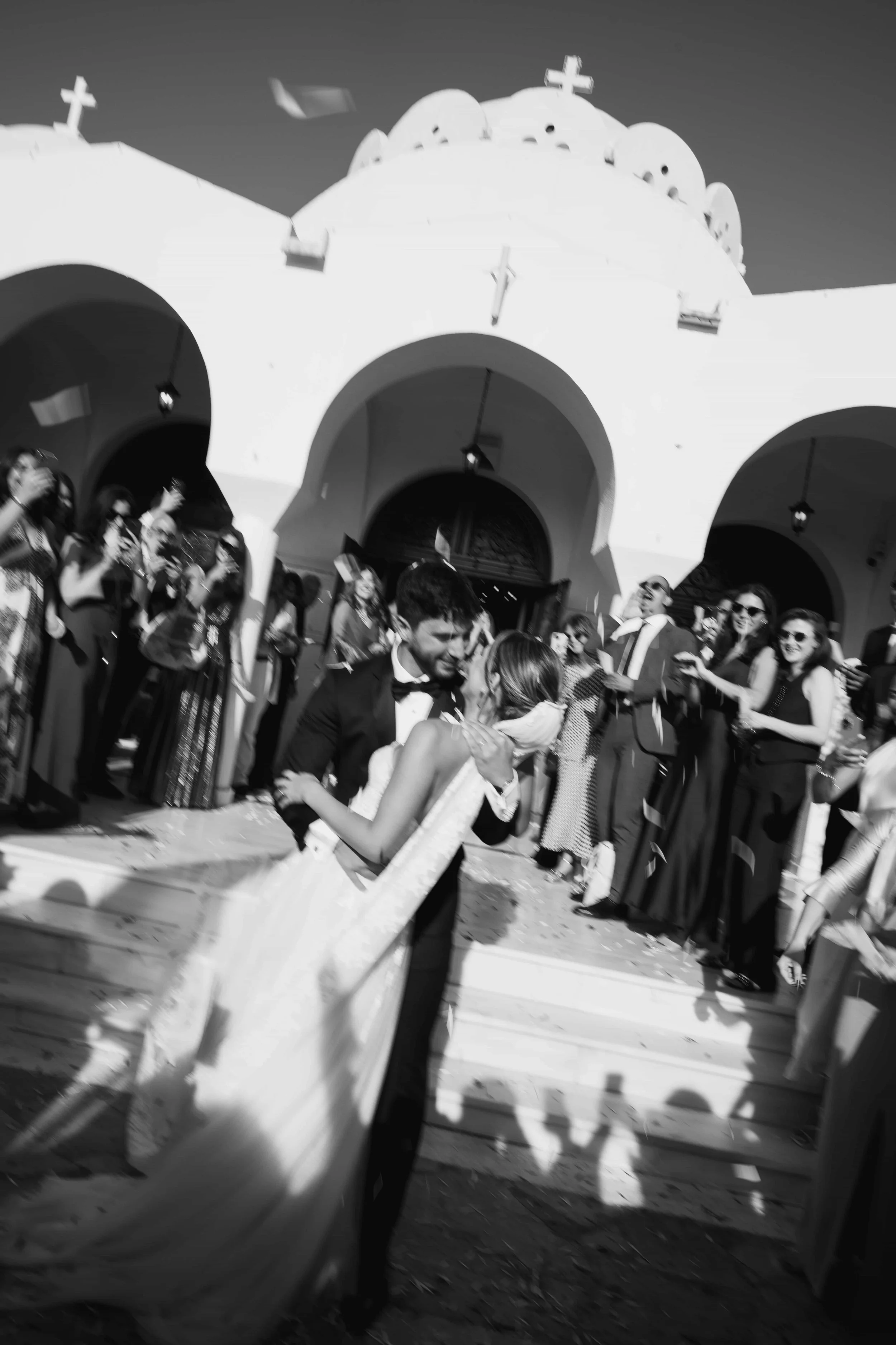 blurry picture of couple in front of church