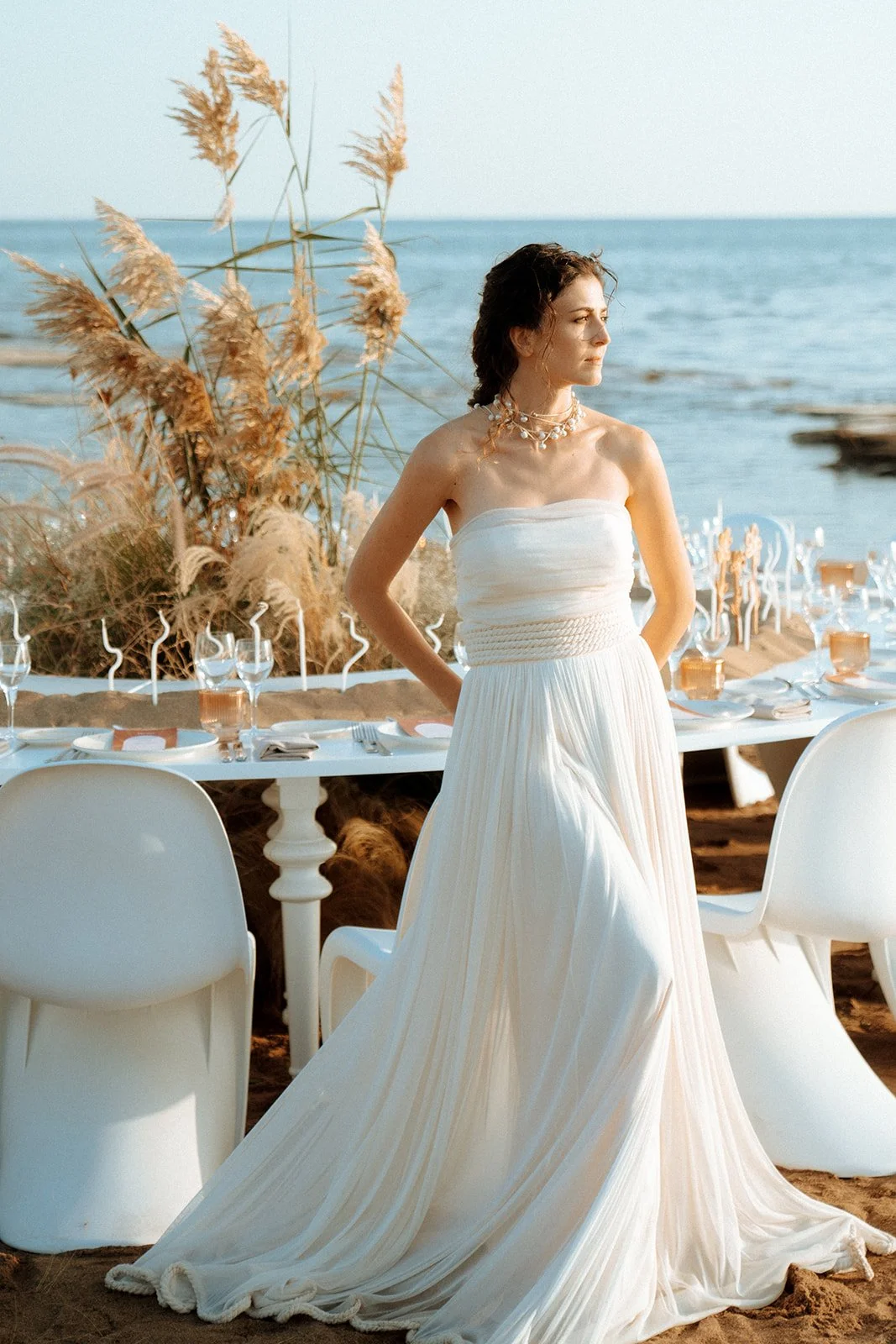 bride posing in front of the table