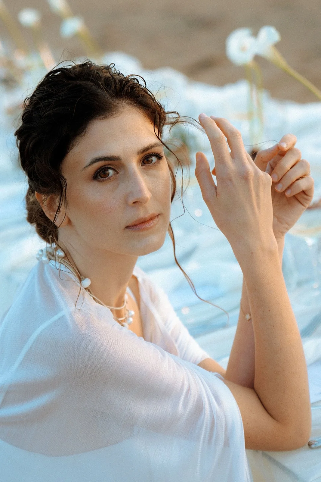 close up shot of a bride sitting on a wedding table 