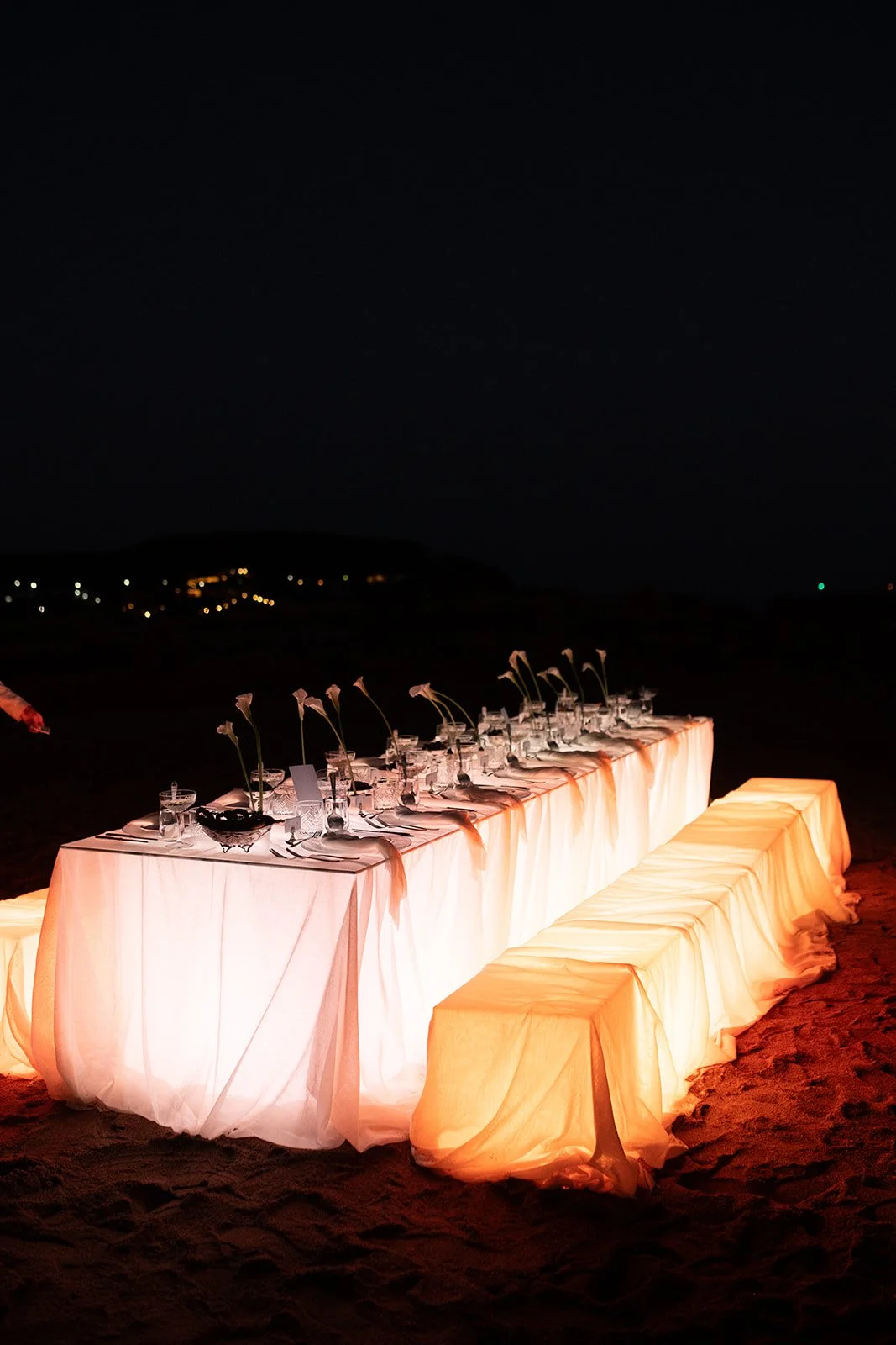 glowing table and benches wedding table setup 