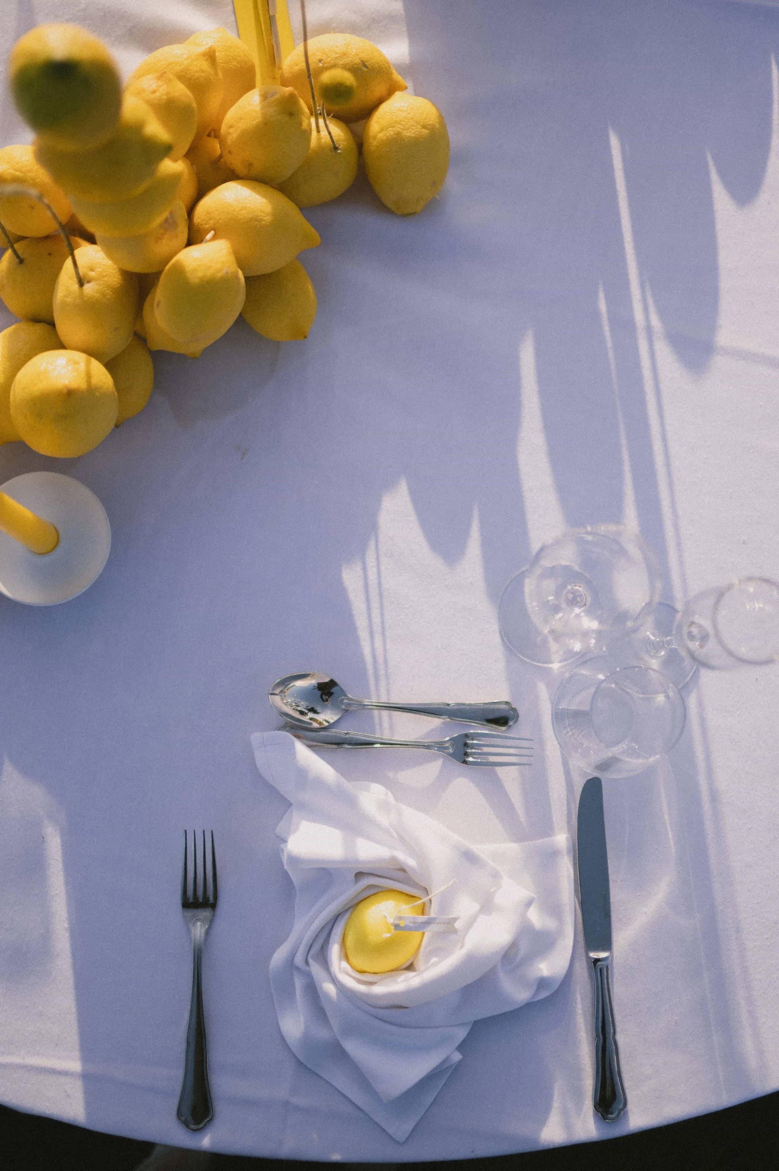 lemon candle wrapped in a white napkin