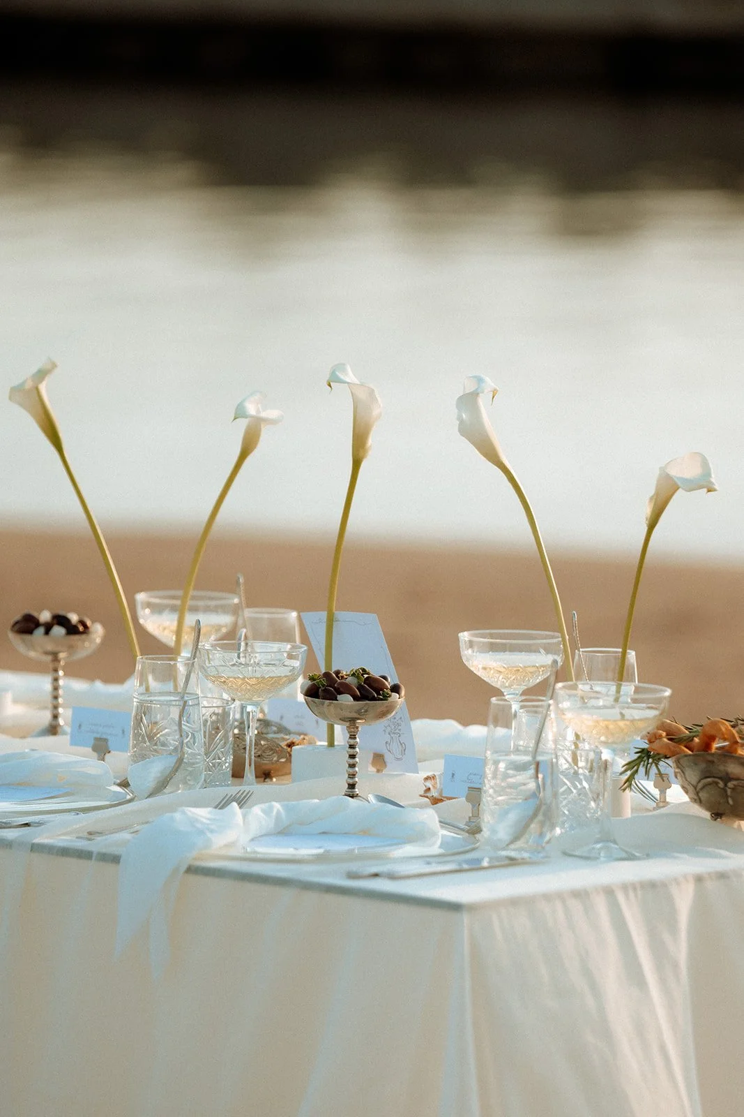 cala lilies and olives wedding decor