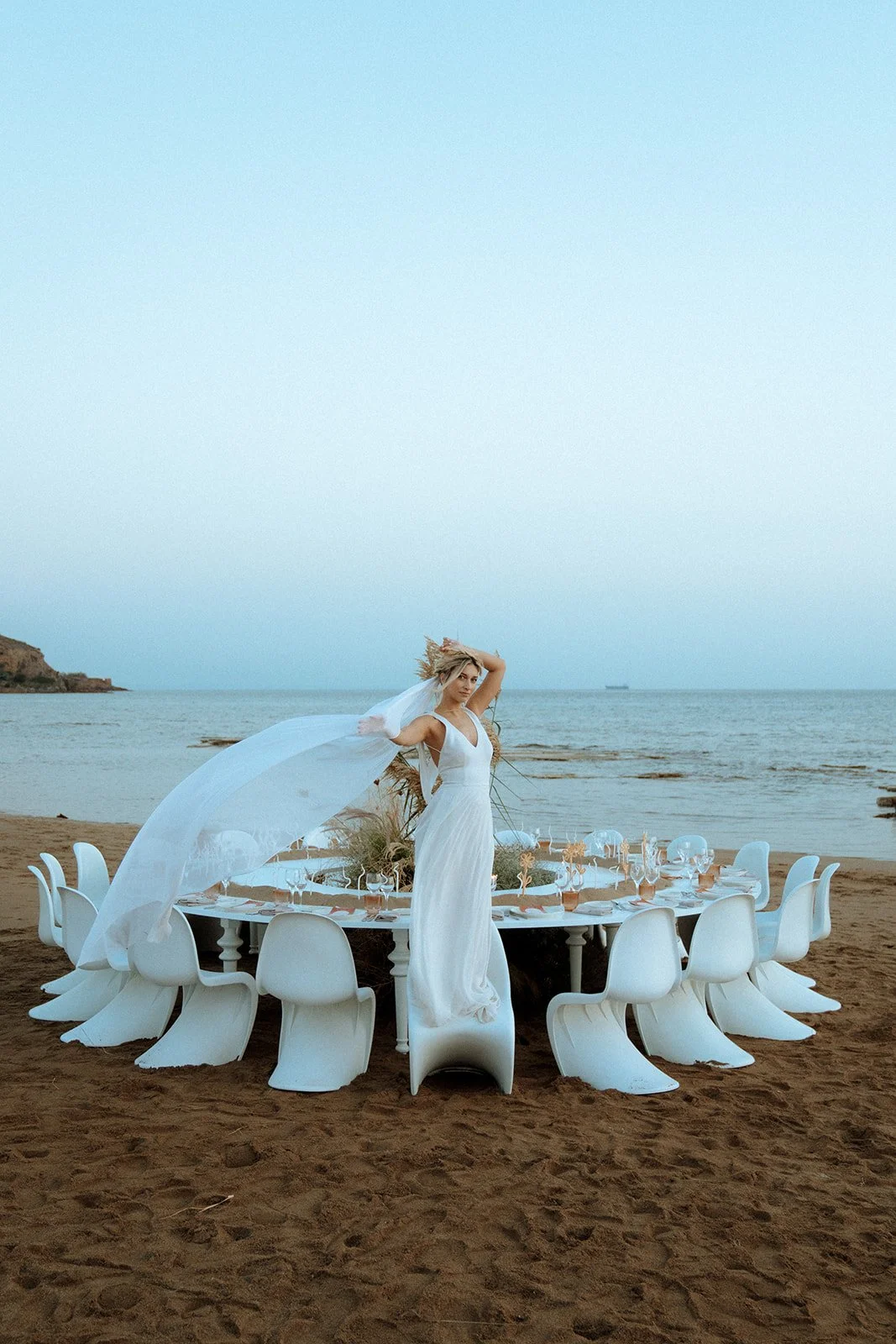 bride standing on a chair 