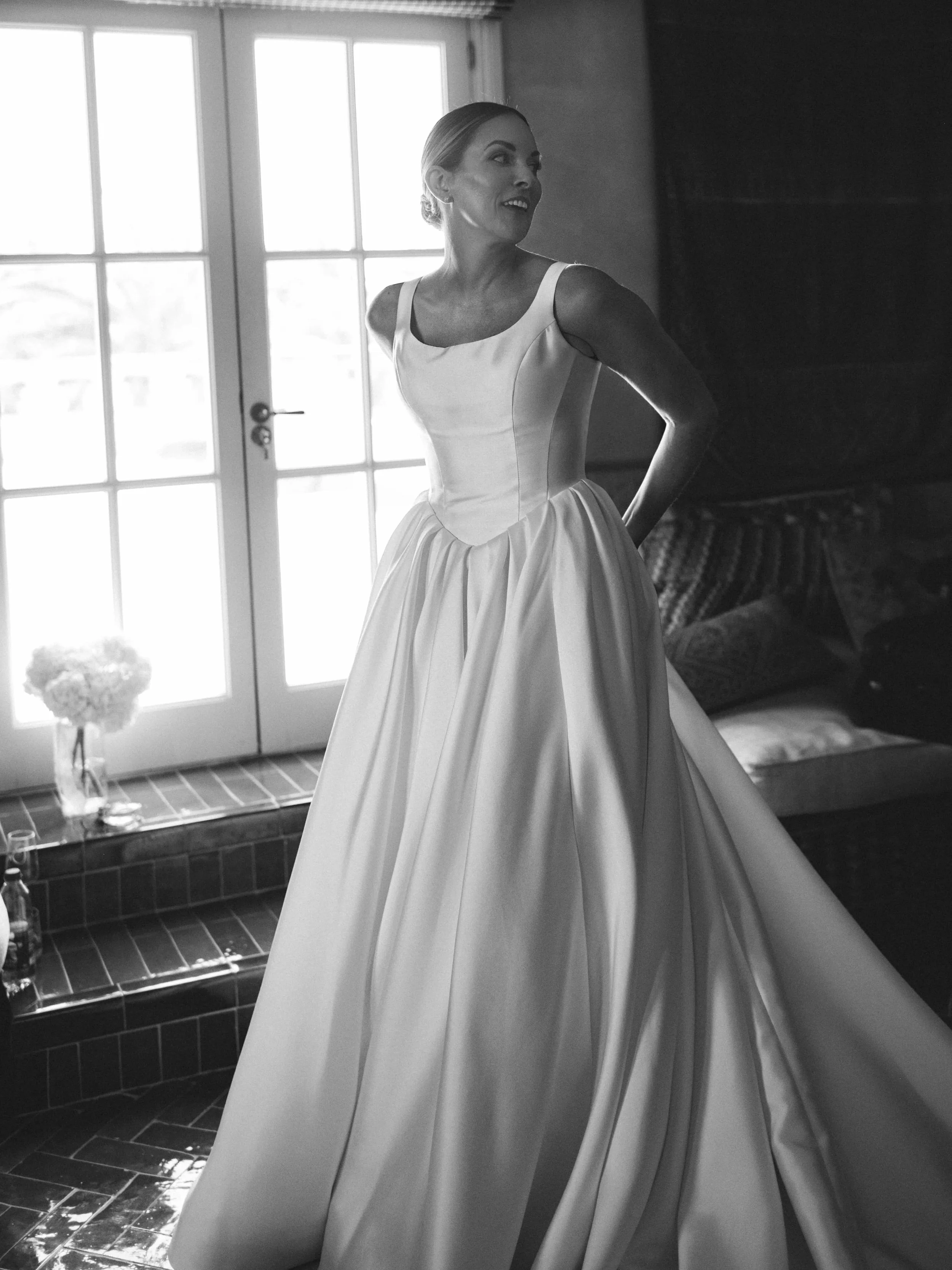 Bride black and white picture looking back and smiling