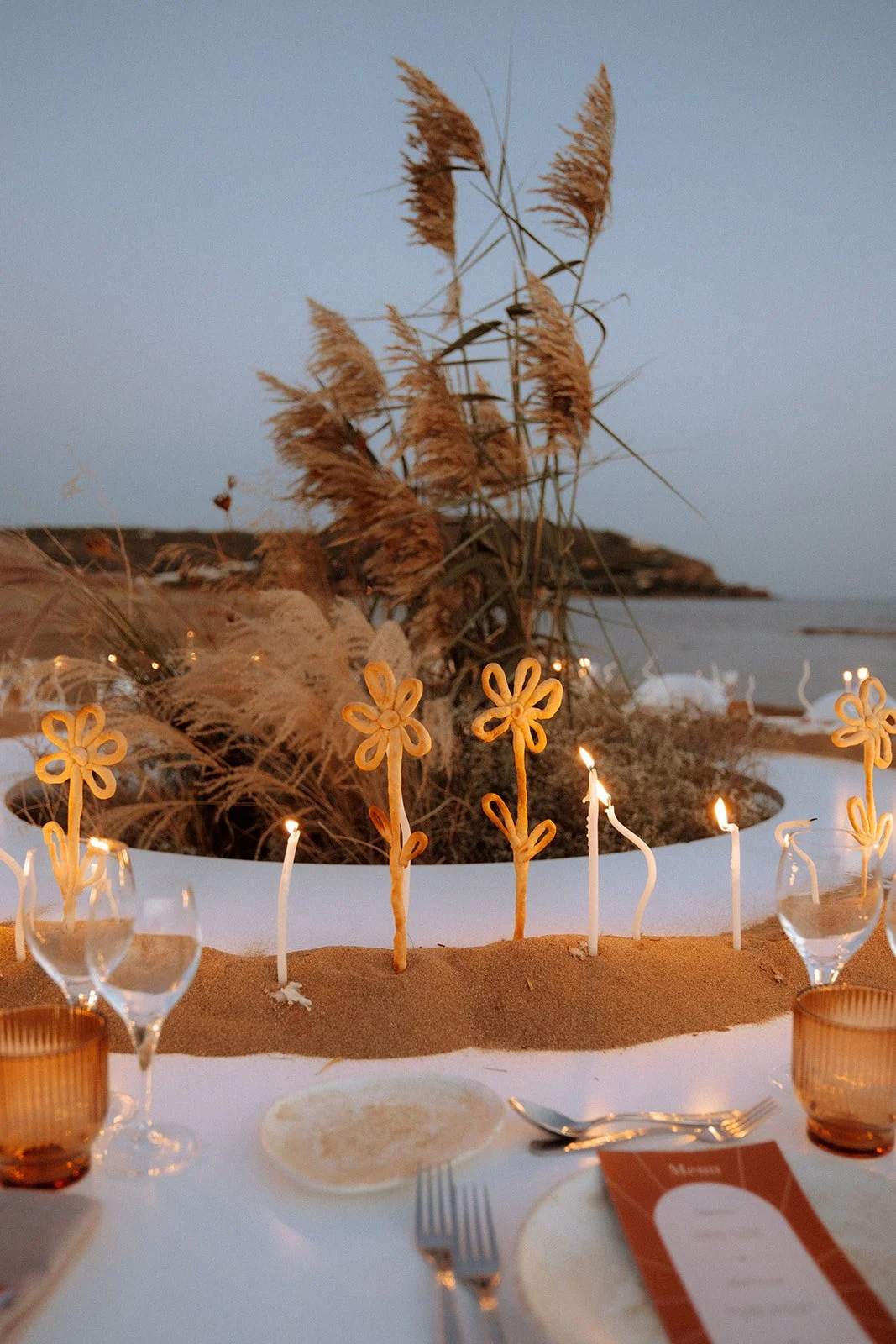 golden hour photograph styled shoot with lit candles 