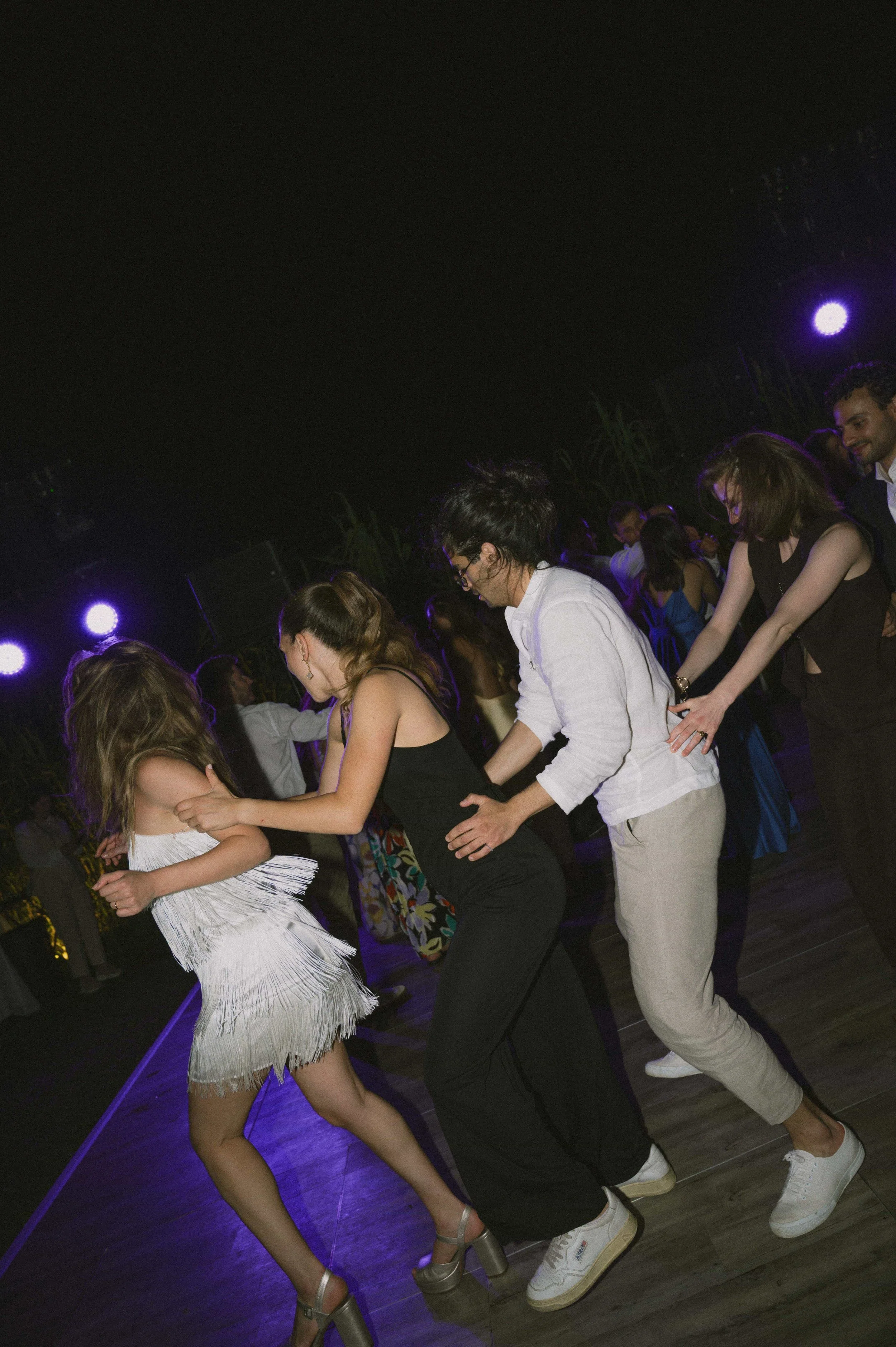 wedding guests doing queue dancing 