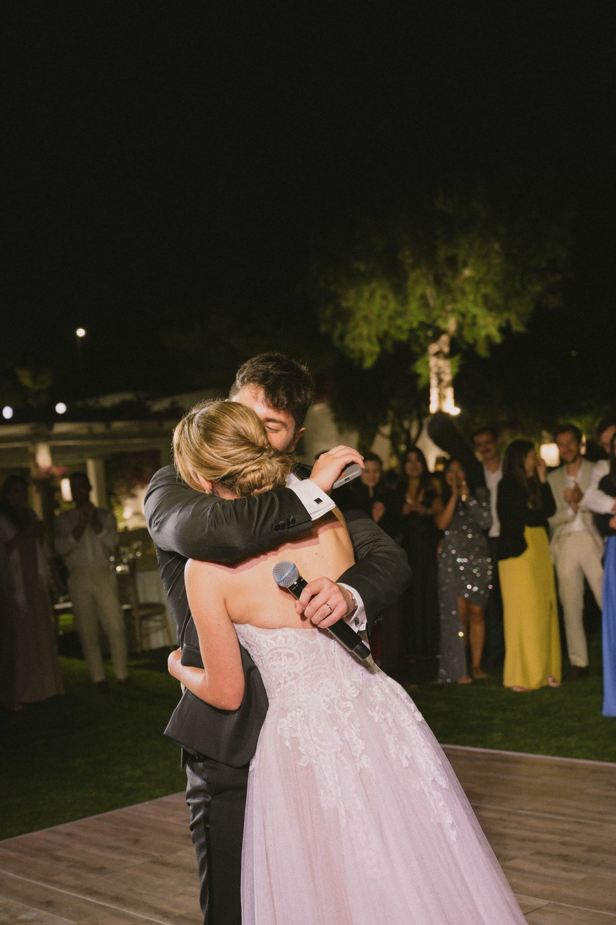 bride and groom hugging